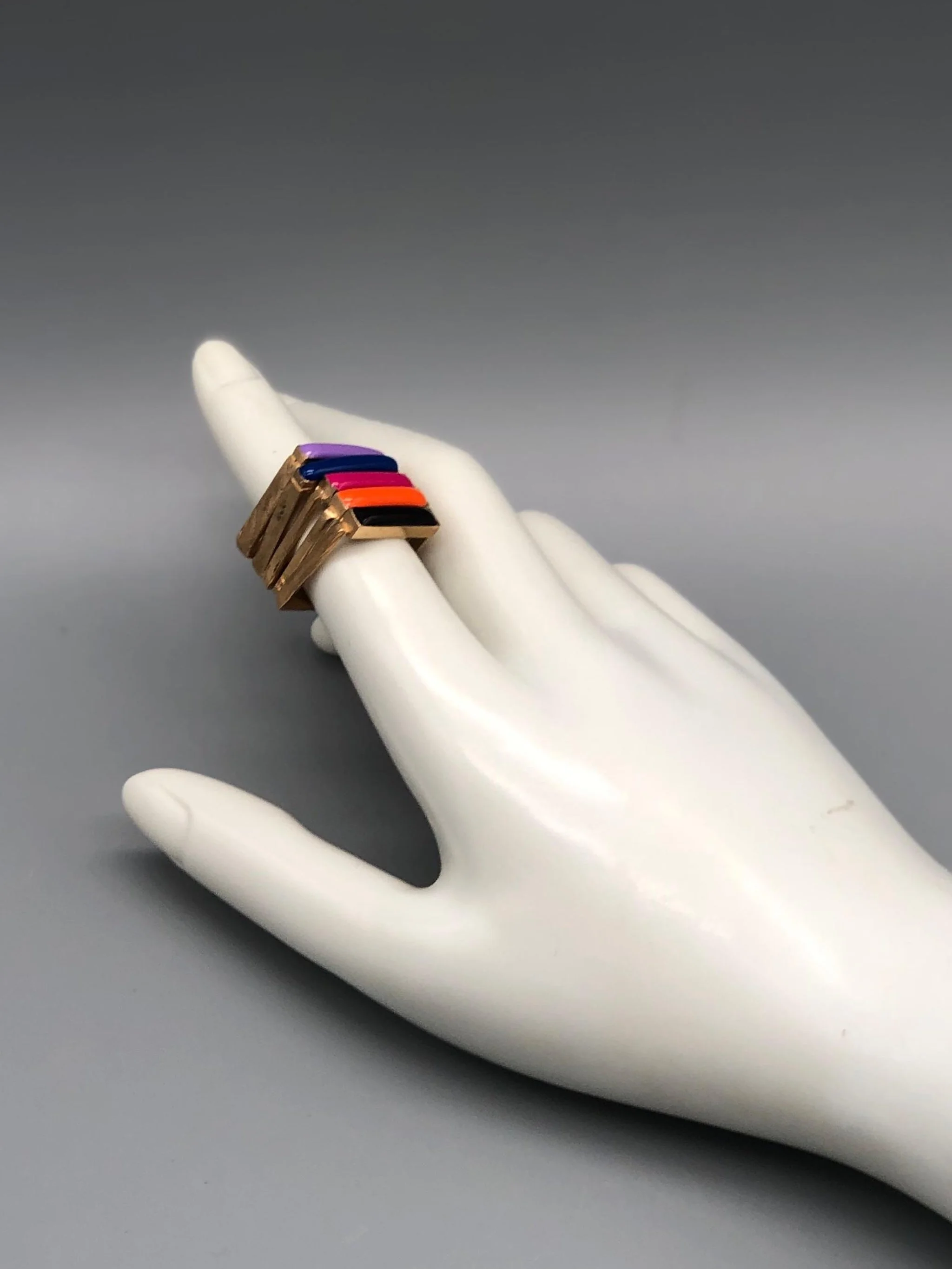 Slim enamel rings in bronze with gold finish, available in black, orange, pink, cornflower blue and purple enamel, Crepundia Gioielli Bologna.
