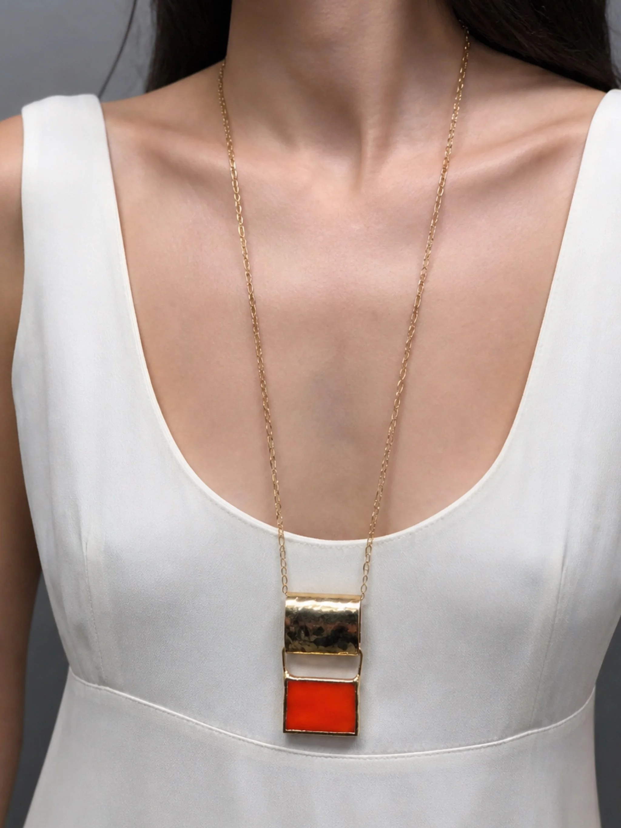 ‘70 Arancio necklace in 18k yellow gold plated brass with orange Murano glass, geometric pendant design — Crepundia Gioielli Bologna
