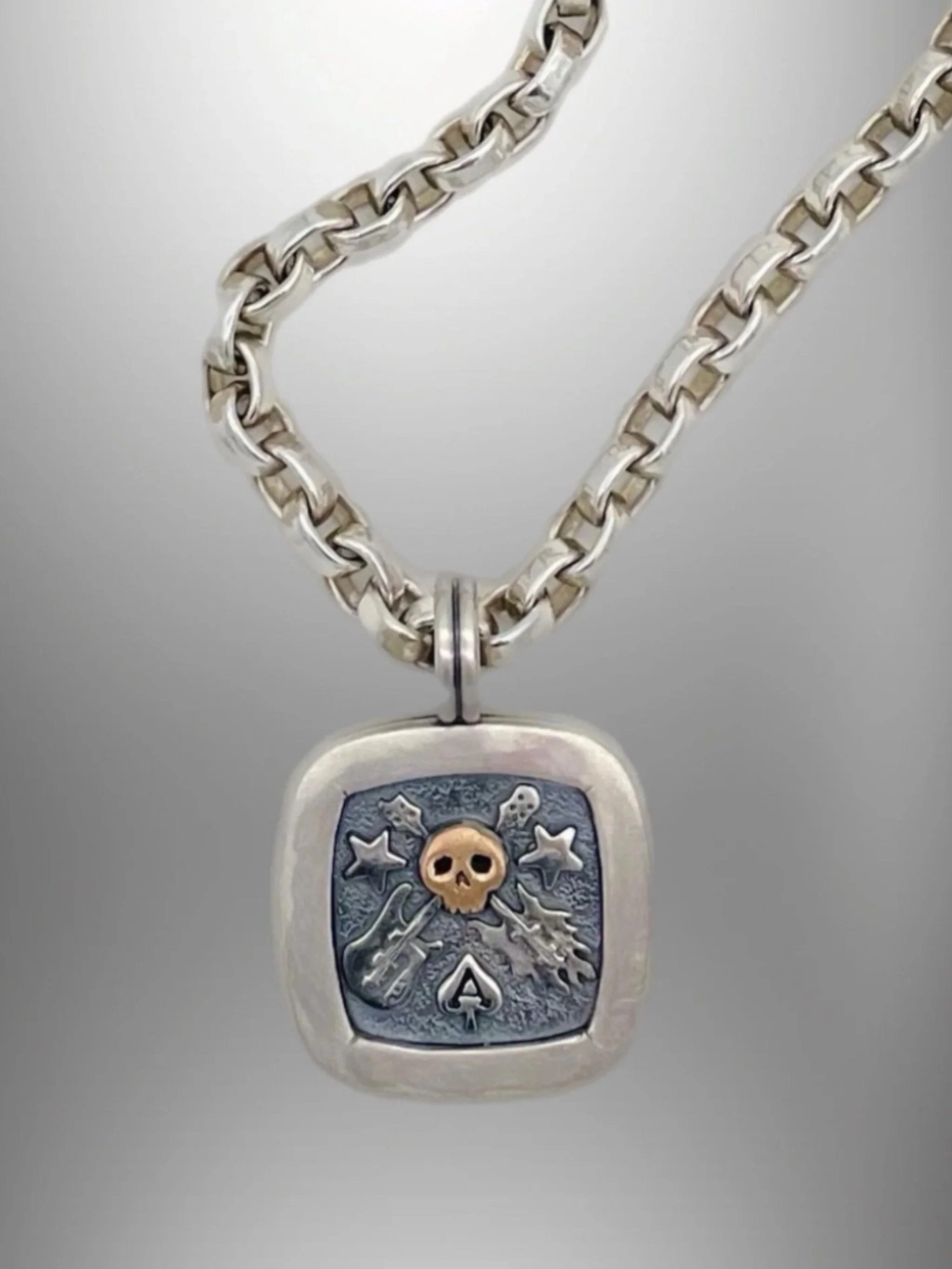 Sonja Markhoff The Ace of Spades Tribute to Rock necklace in sterling silver and 18 kt rose gold for Crepundia Gioielli Bologna.