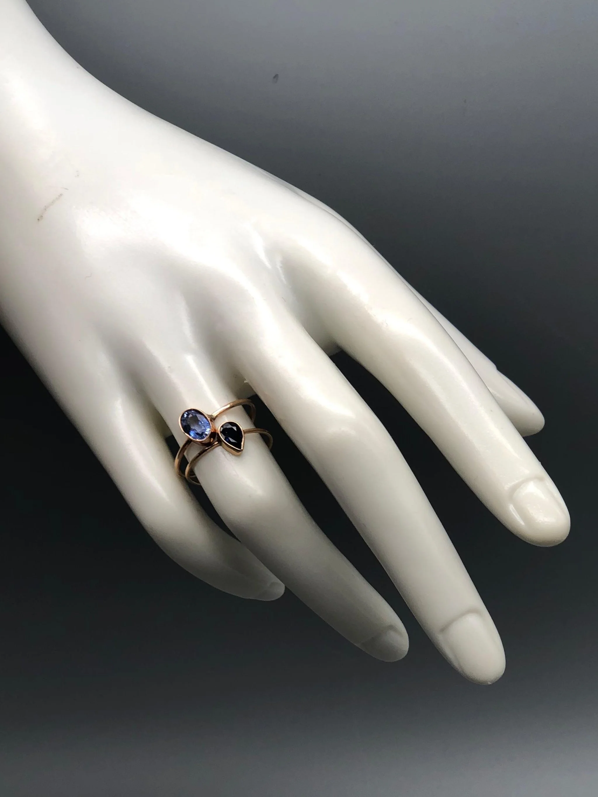 Stacked rings with pear-shaped sapphire and blue gemstone in 14k gold — Maria Gioielli at Crepundia