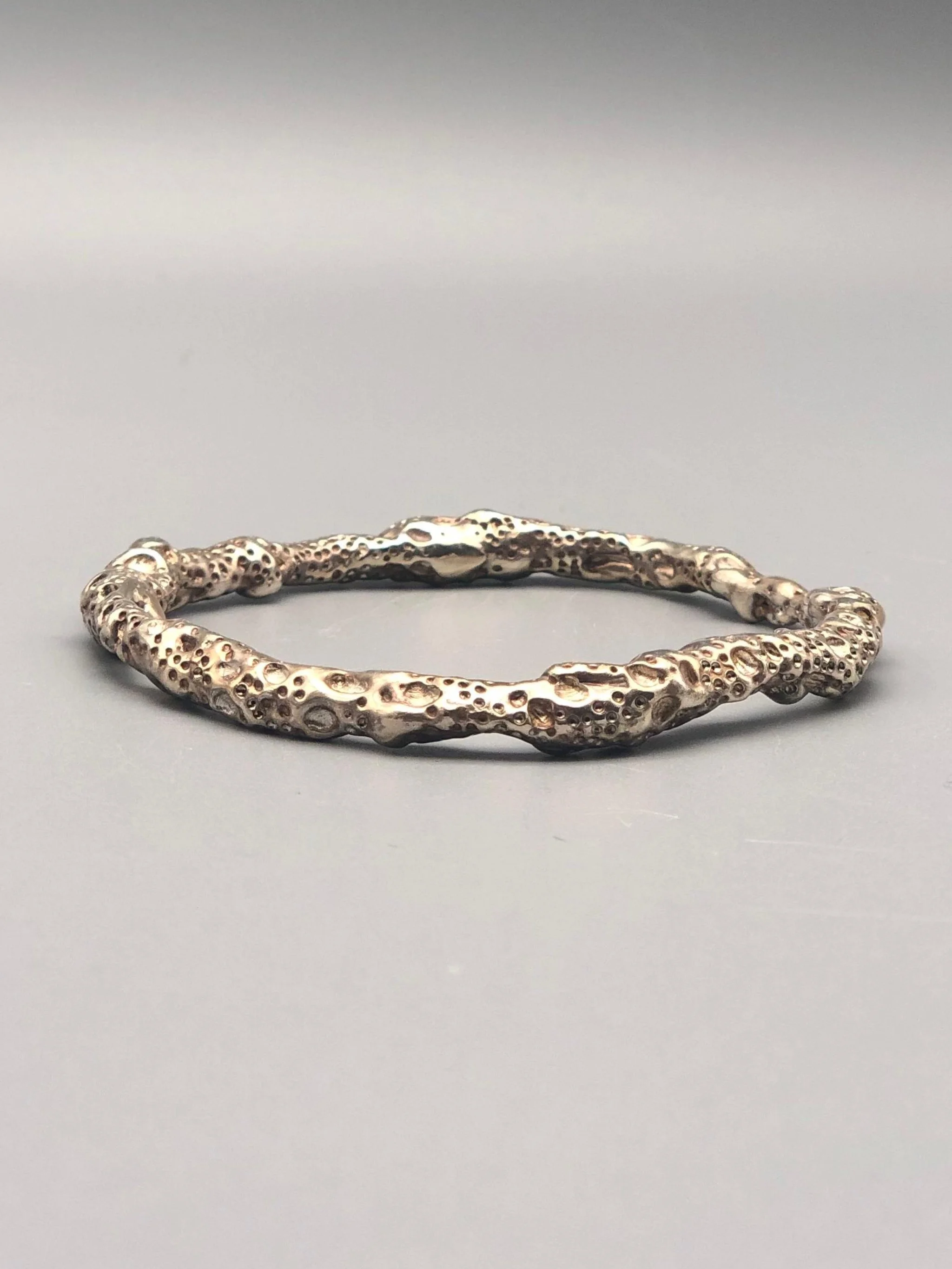 textured silver lunar surface bracelet Portas Jewels — Crepundia Bologna contemporary jewelry