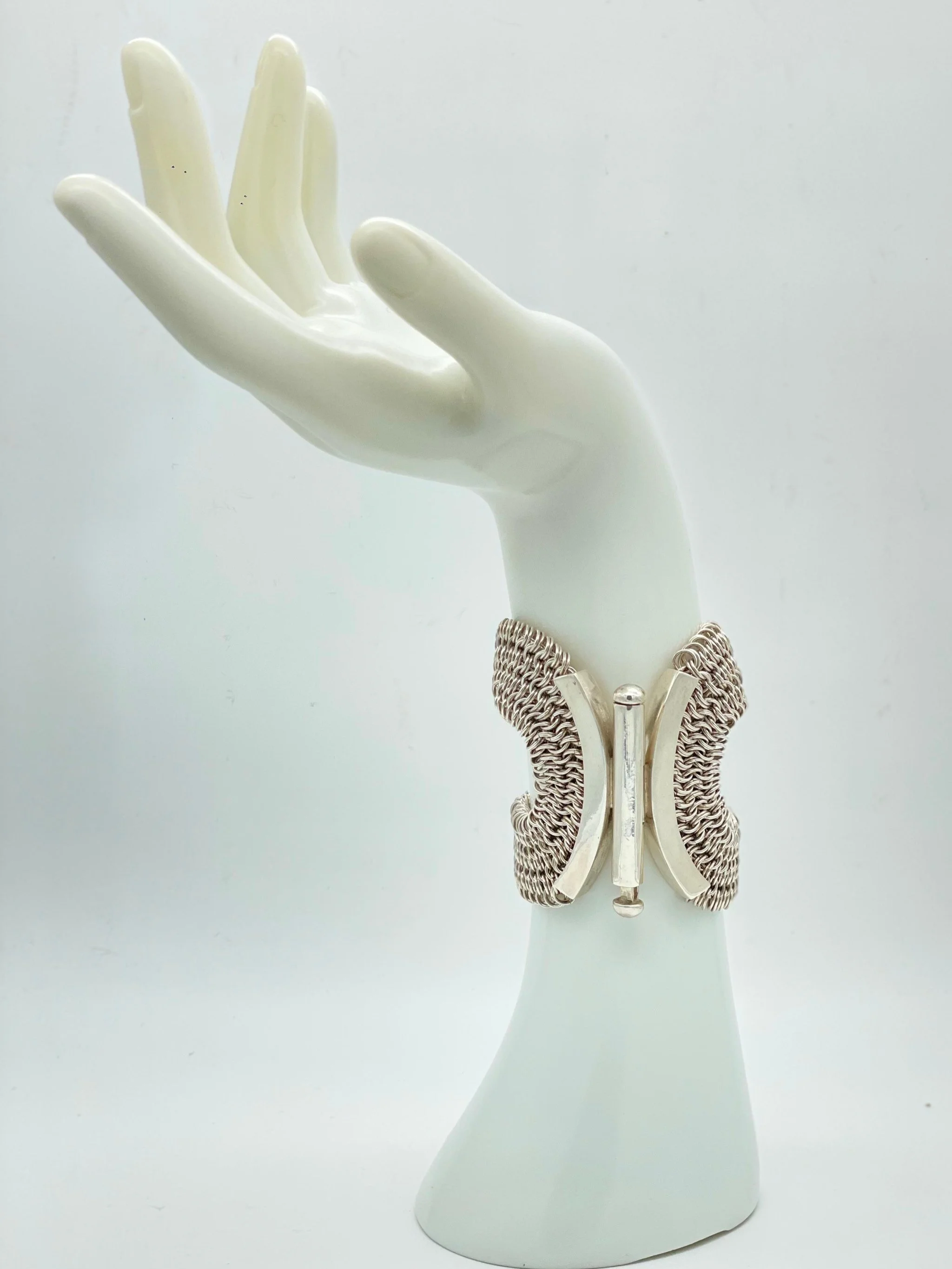 Sterling silver sculptural bracelet by Ariadna Segafredo for Crepundia Gioielli Bologna, wide woven chain with rigid elements, contemporary statement piece