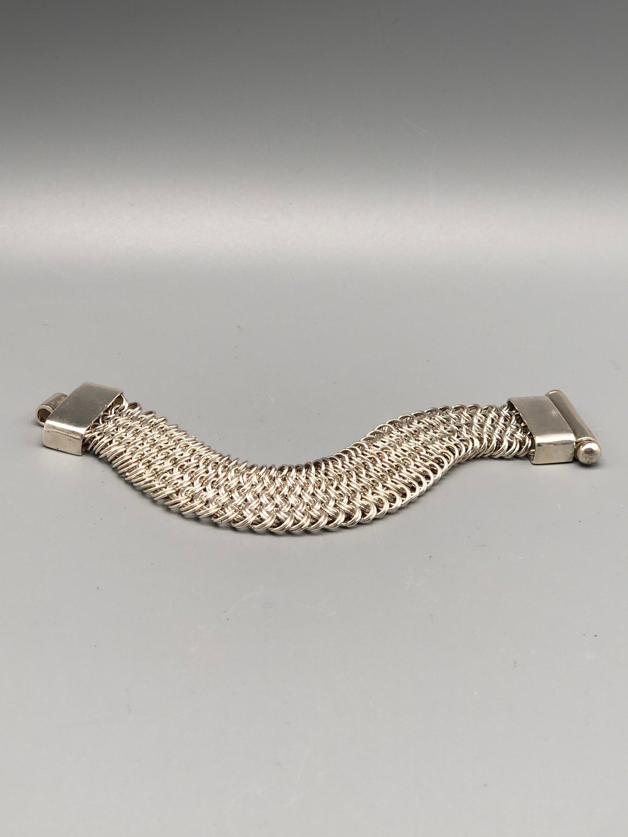 Double Chain Bracelet by Ariadna Segafredo for Crepundia Gioielli in sterling silver, wide woven chain texture and geometric clasp