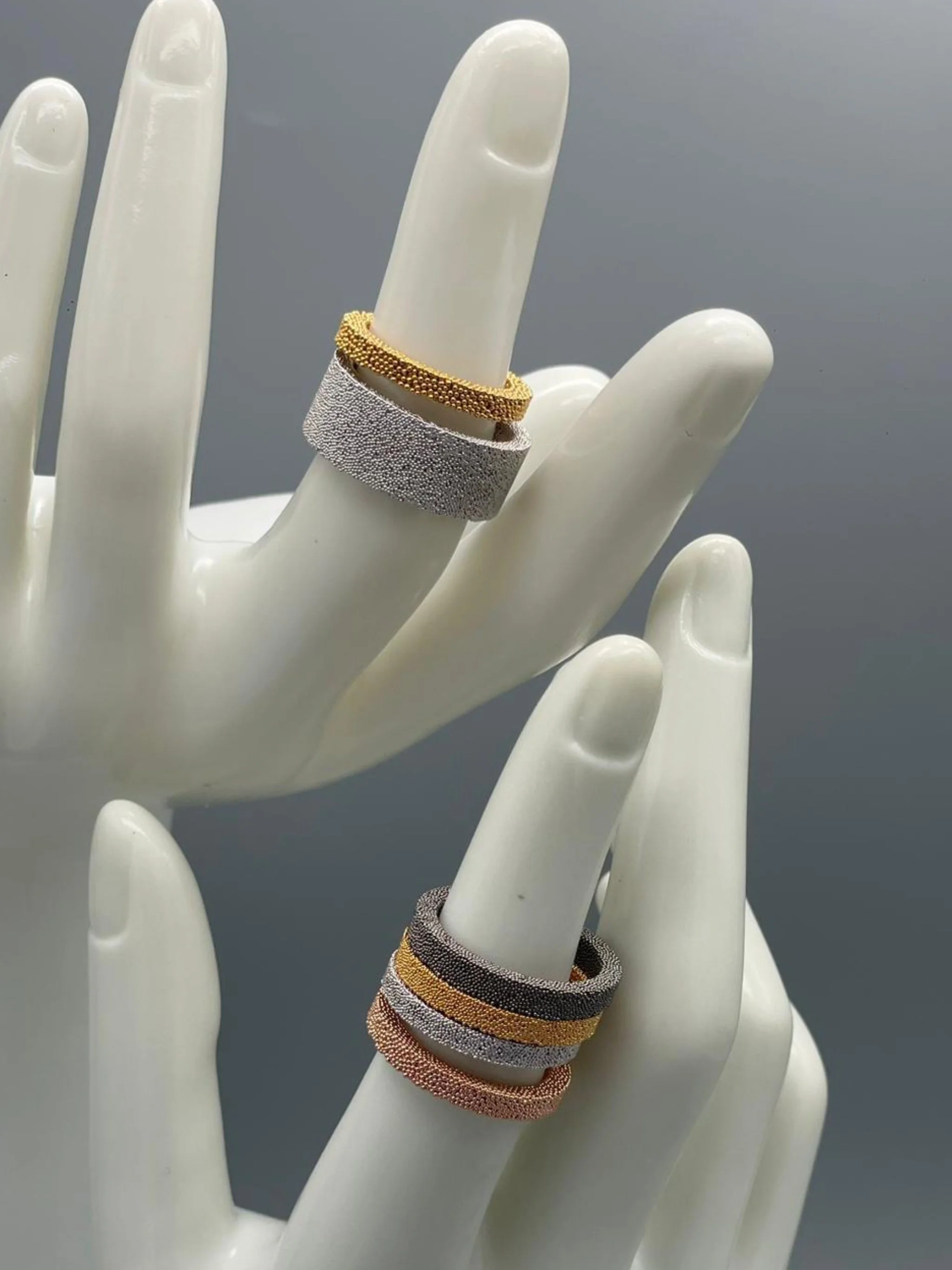 Ring Materia 01 by Francesca Valpiani in granular textured metal, sculptural band design — Crepundia Bologna