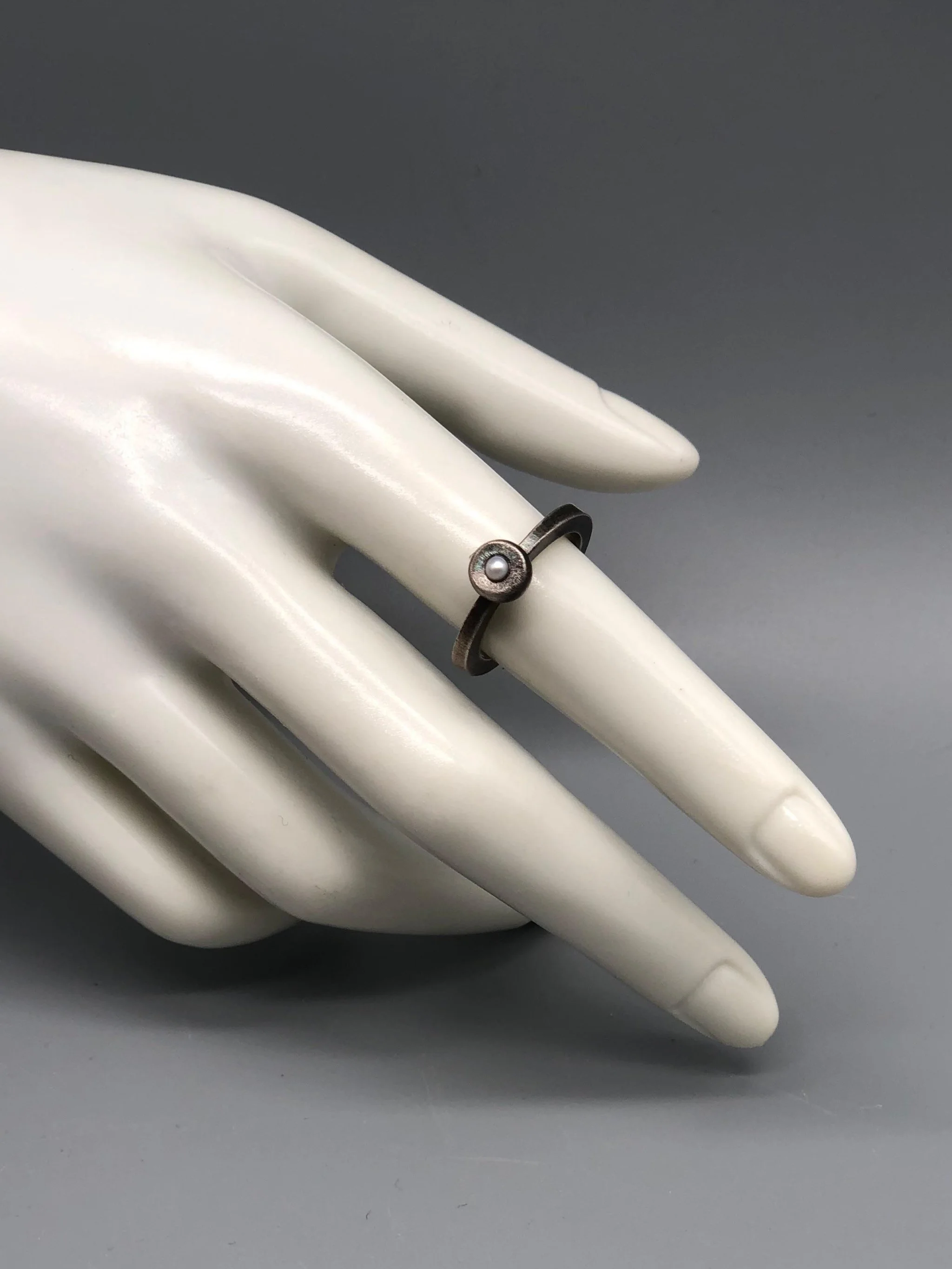 Contemporah Bulls rings in oxidized sterling silver with Japanese pearl — Crepundia Gioielli Bologna