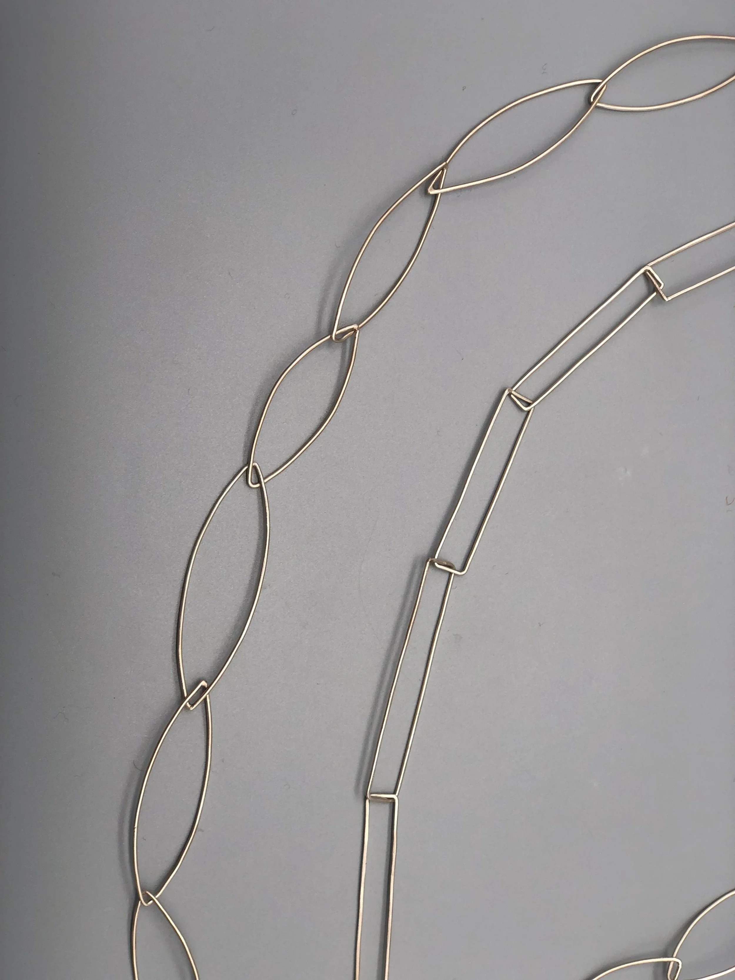 Rectangular and oval modular silver necklaces detail .111 capsule collection — Crepundia Gioielli — Crepundia Bologna minimalist design