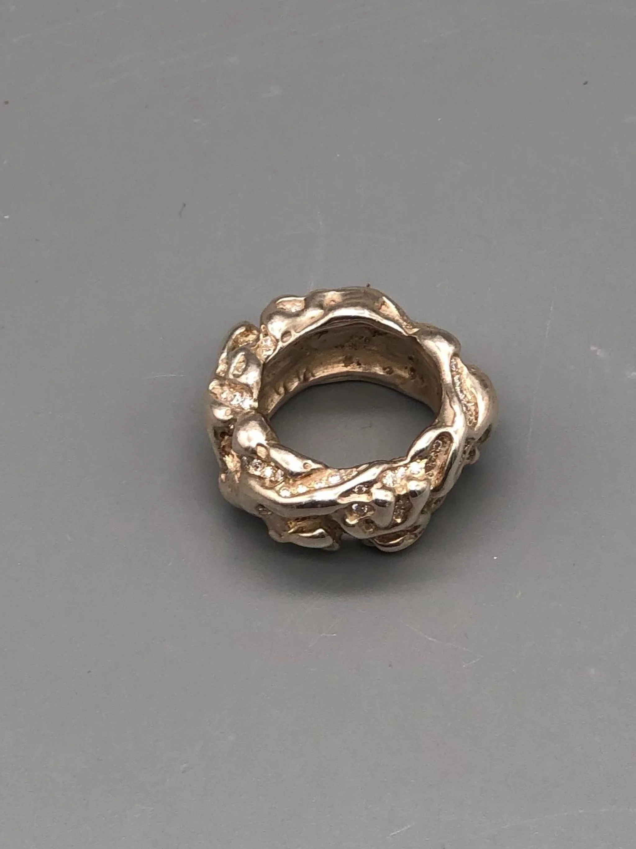Portas Jewels Skinwalker ring set with 142 moissanites, featuring an intricate organic surface and sculptural silver band.
