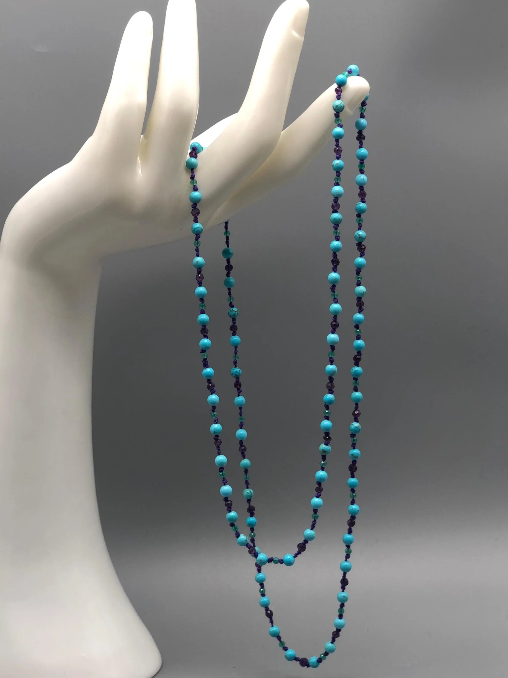 Summer necklace with turquoise, amethyst and aventurine on purple cotton cord. Crepundia Gioielli Bologna.