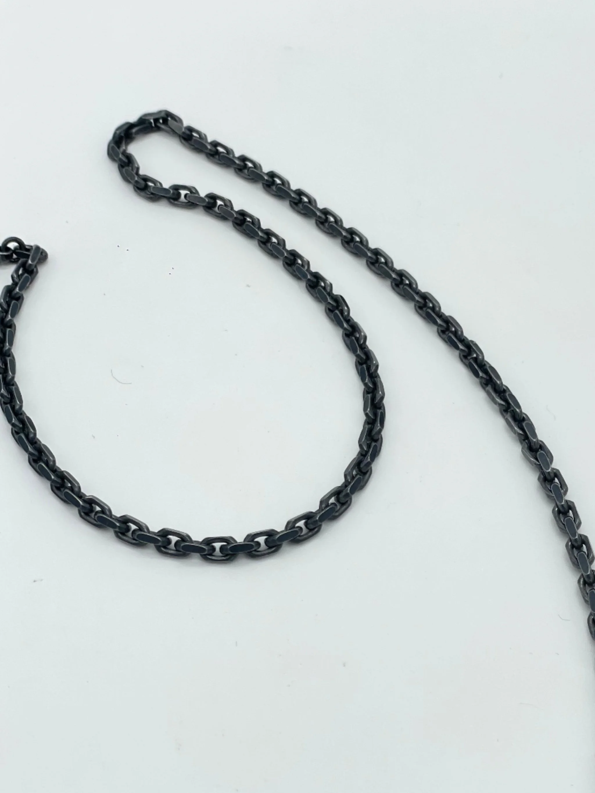 Sonja Markhoff Calavera de Dulce Cutout pendant in sterling silver with oxidized filed trace chain, contemporary skull necklace by Crepundia Gioielli Bologna