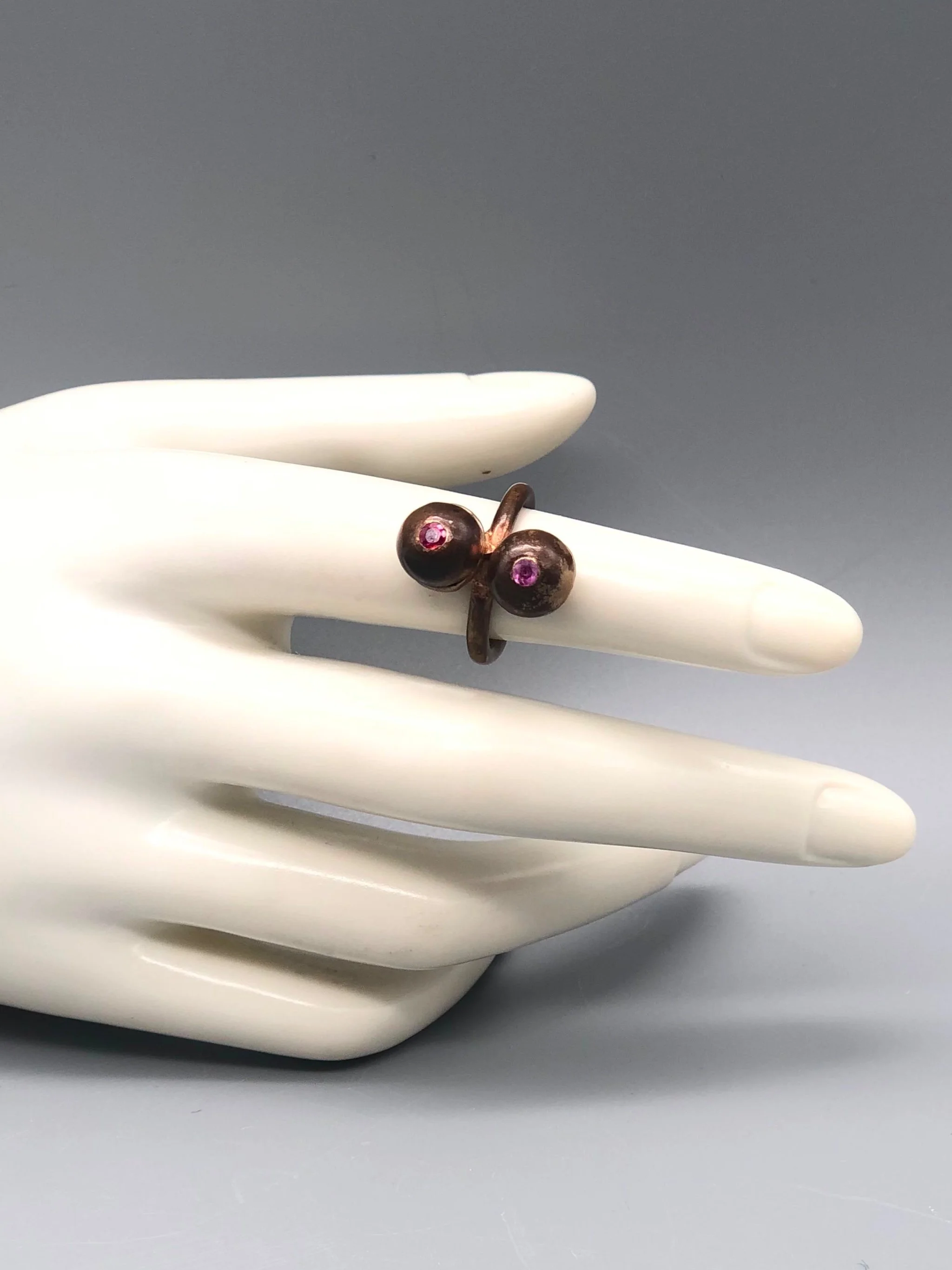Raimondi bronze ring with ruby and pink sapphire.