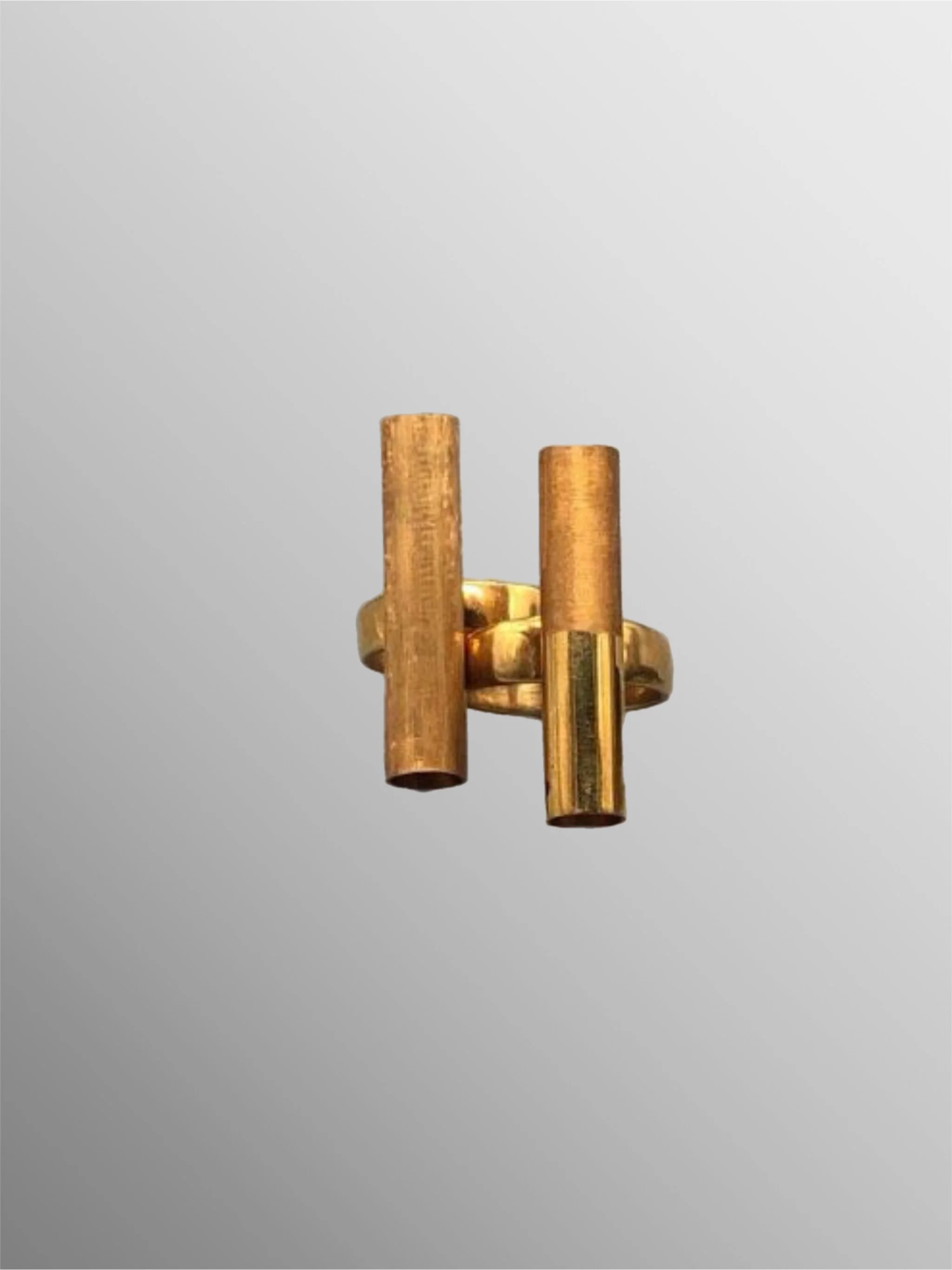 Two HoAsen Jewelry tube rings in gilded sterling silver with contrasting satin and polished finishes — Crepundia Gioielli Bologna