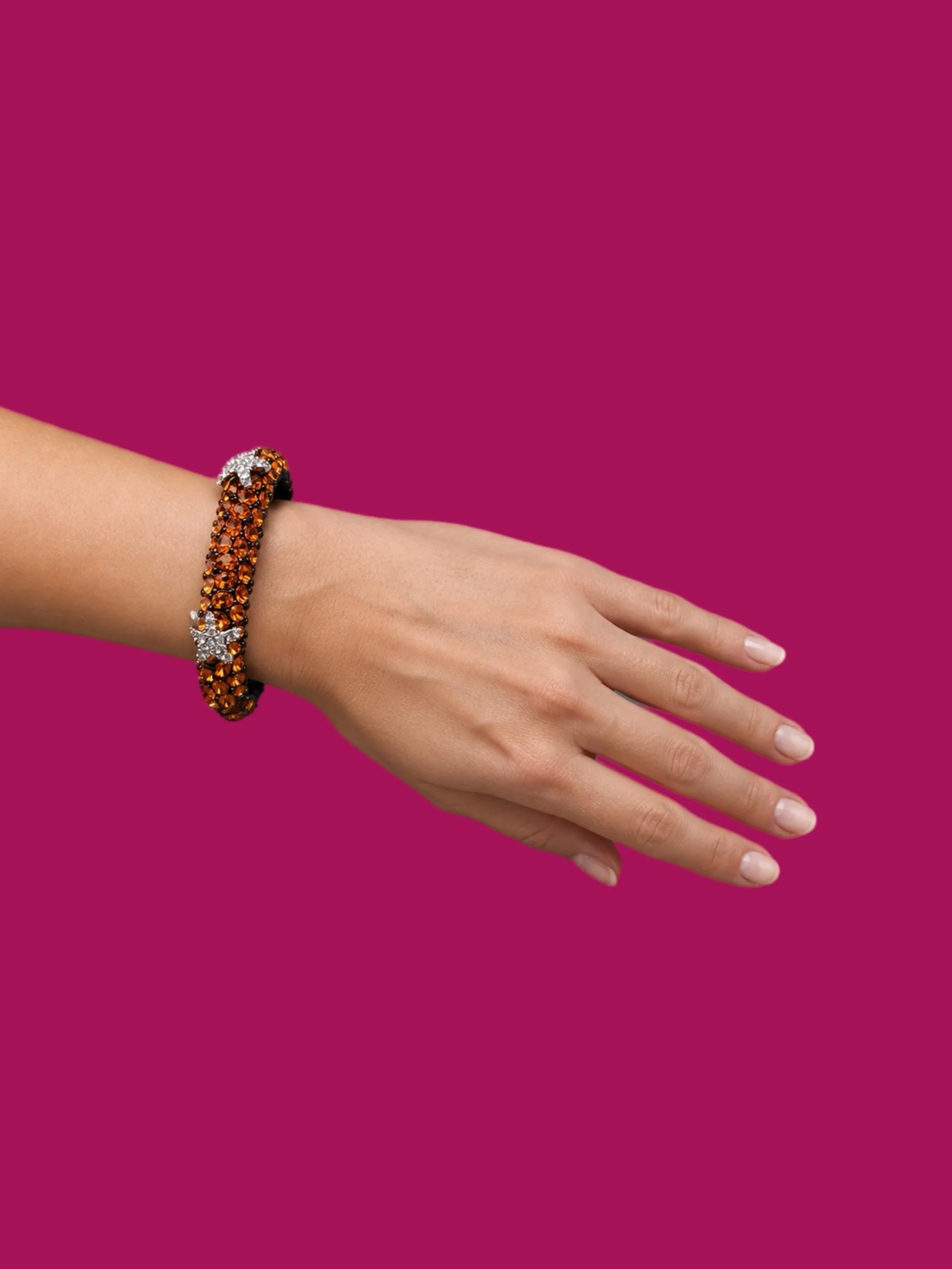 Kenneth Jay Lane costume jewelry bracelet with amber-colored crystals and starfish details, gold-tone rigid bracelet, Crepundia Gioielli Bologna
