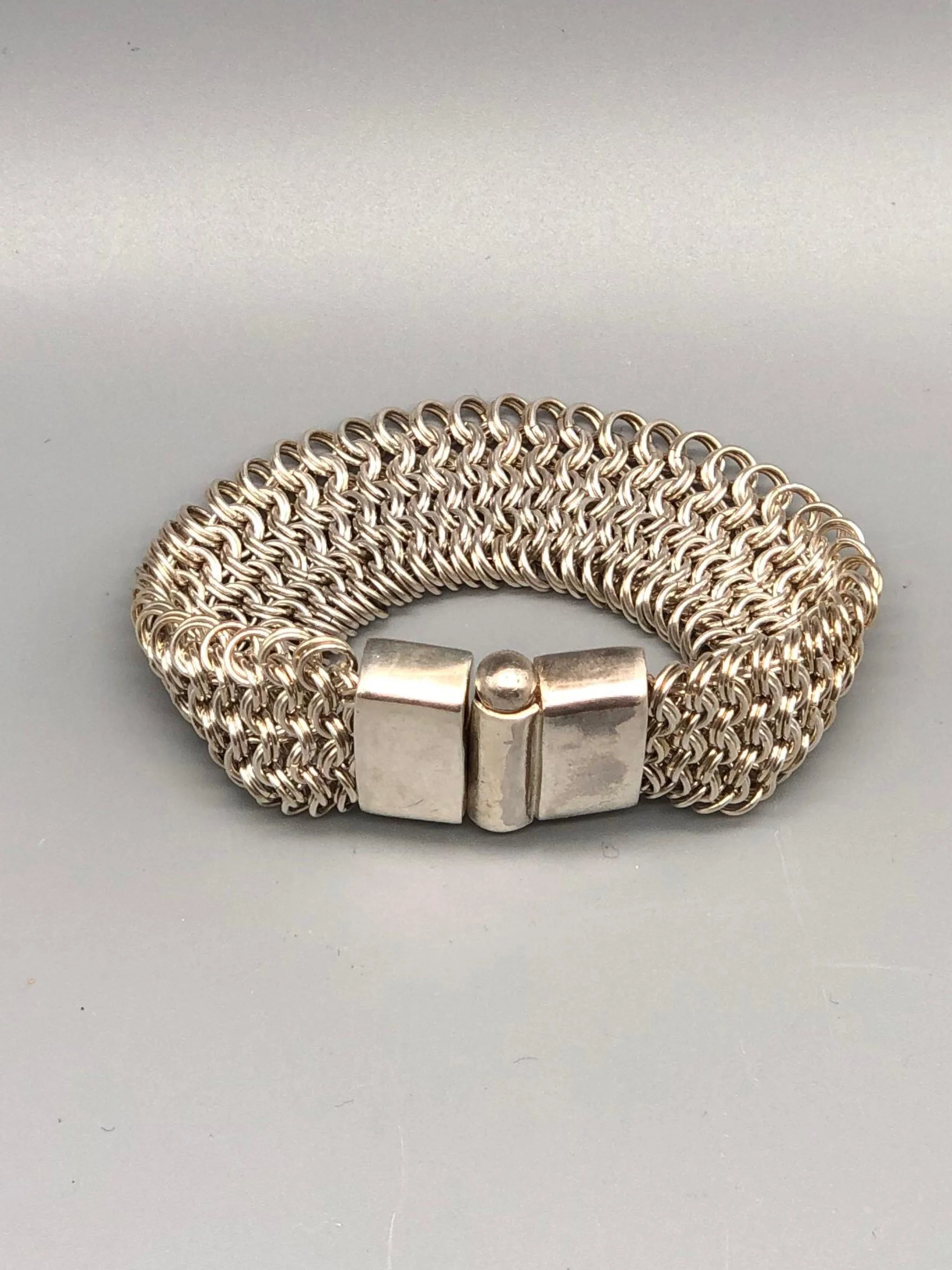 Double Chain Bracelet by Ariadna Segafredo for Crepundia Gioielli in sterling silver, wide woven chain texture and geometric clasp