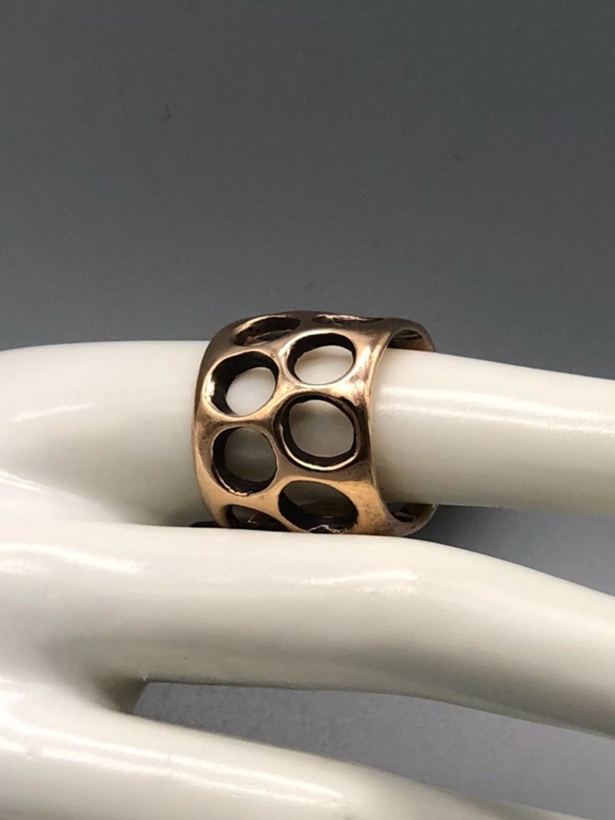 Padma Gruviera ring in rose bronze with sculptural openwork structure. Contemporary handmade statement ring photographed at Crepundia Gioielli Bologna.