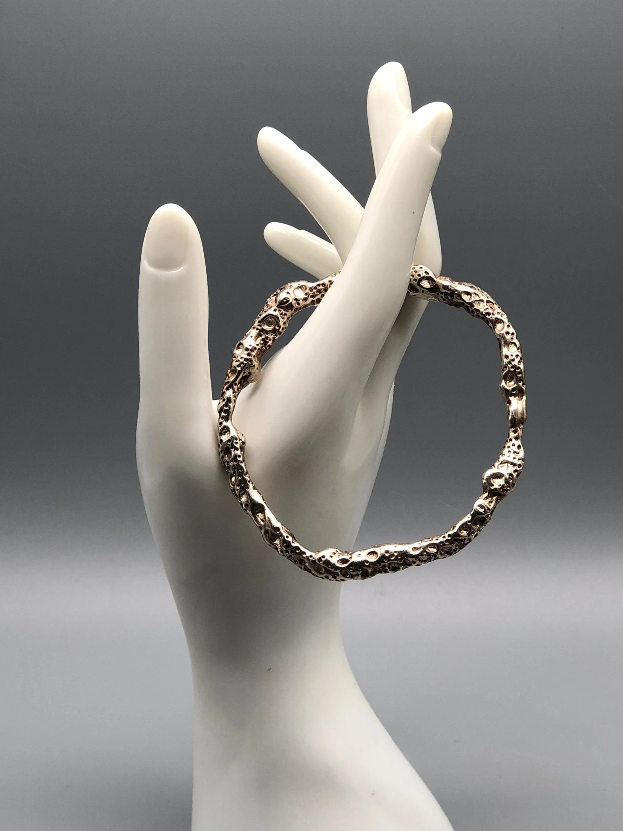 textured silver lunar surface bracelet Portas Jewels — Crepundia Bologna contemporary jewelry