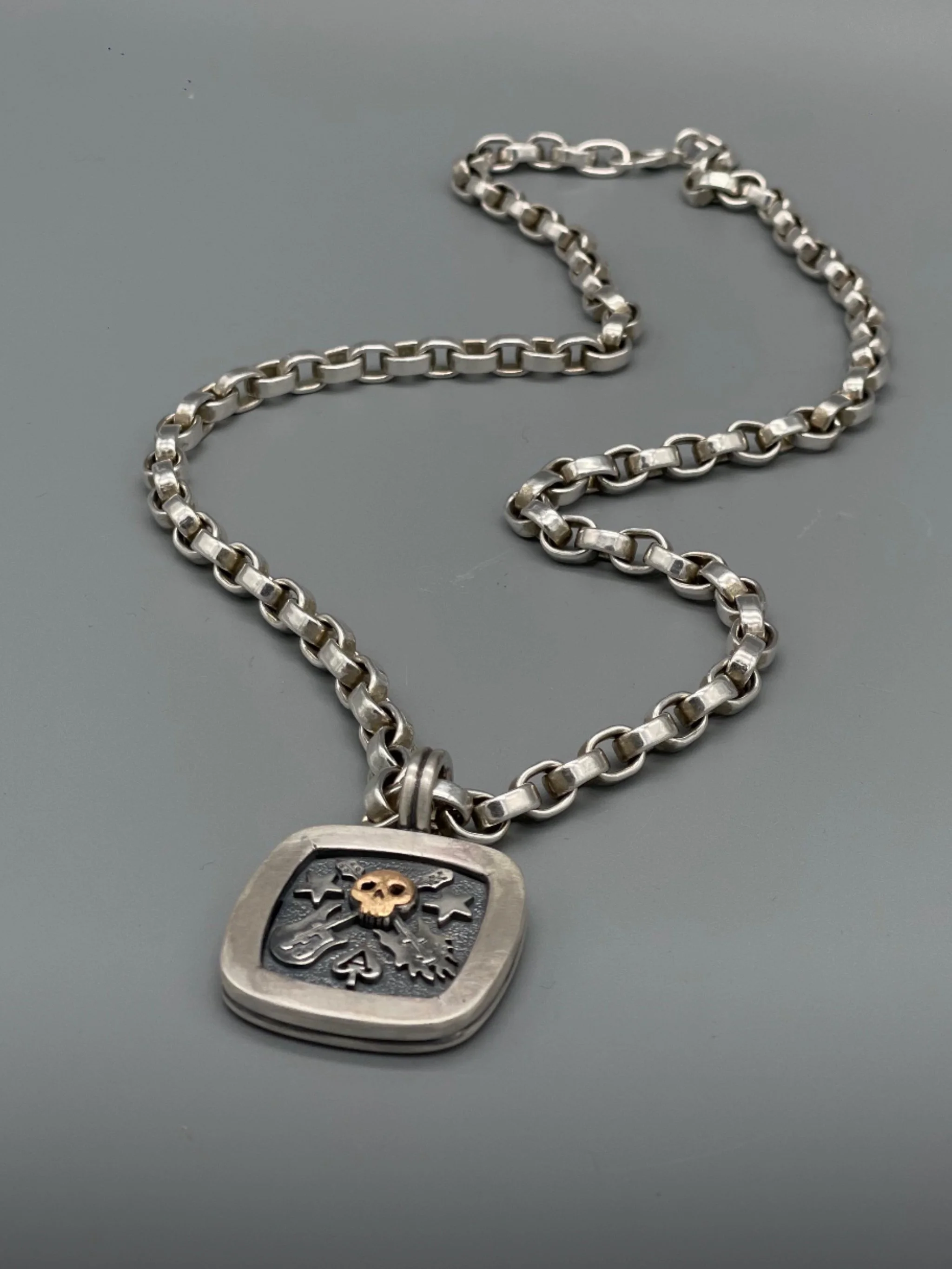 Sonja Markhoff The Ace of Spades Tribute to Rock necklace in sterling silver and 18 kt rose gold for Crepundia Gioielli Bologna.
