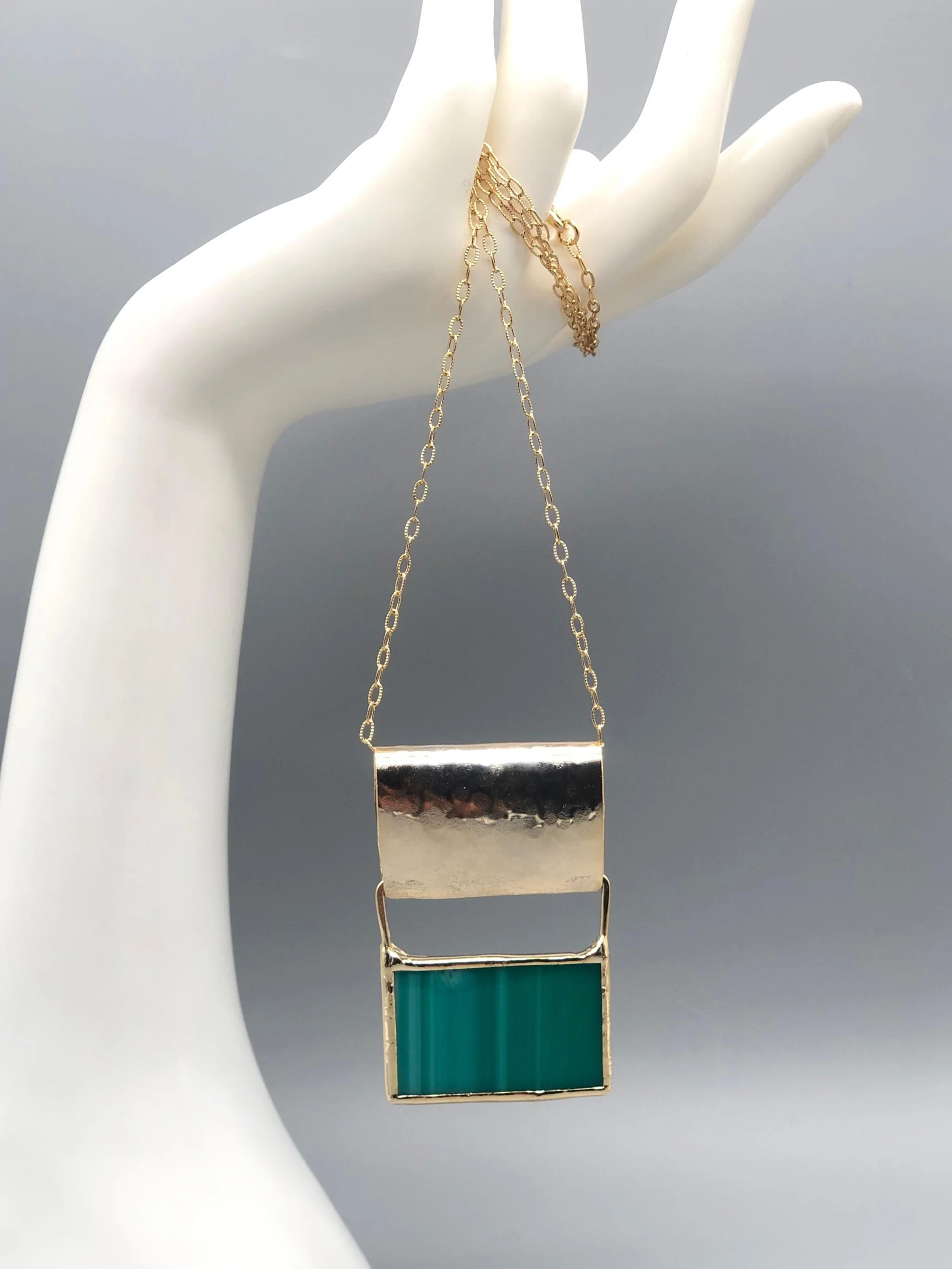 ‘70 Azzurro necklace by Anni Luce for Crepundia Gioielli Bologna, 18k yellow gold plated brass with blue Murano glass, geometric pendant