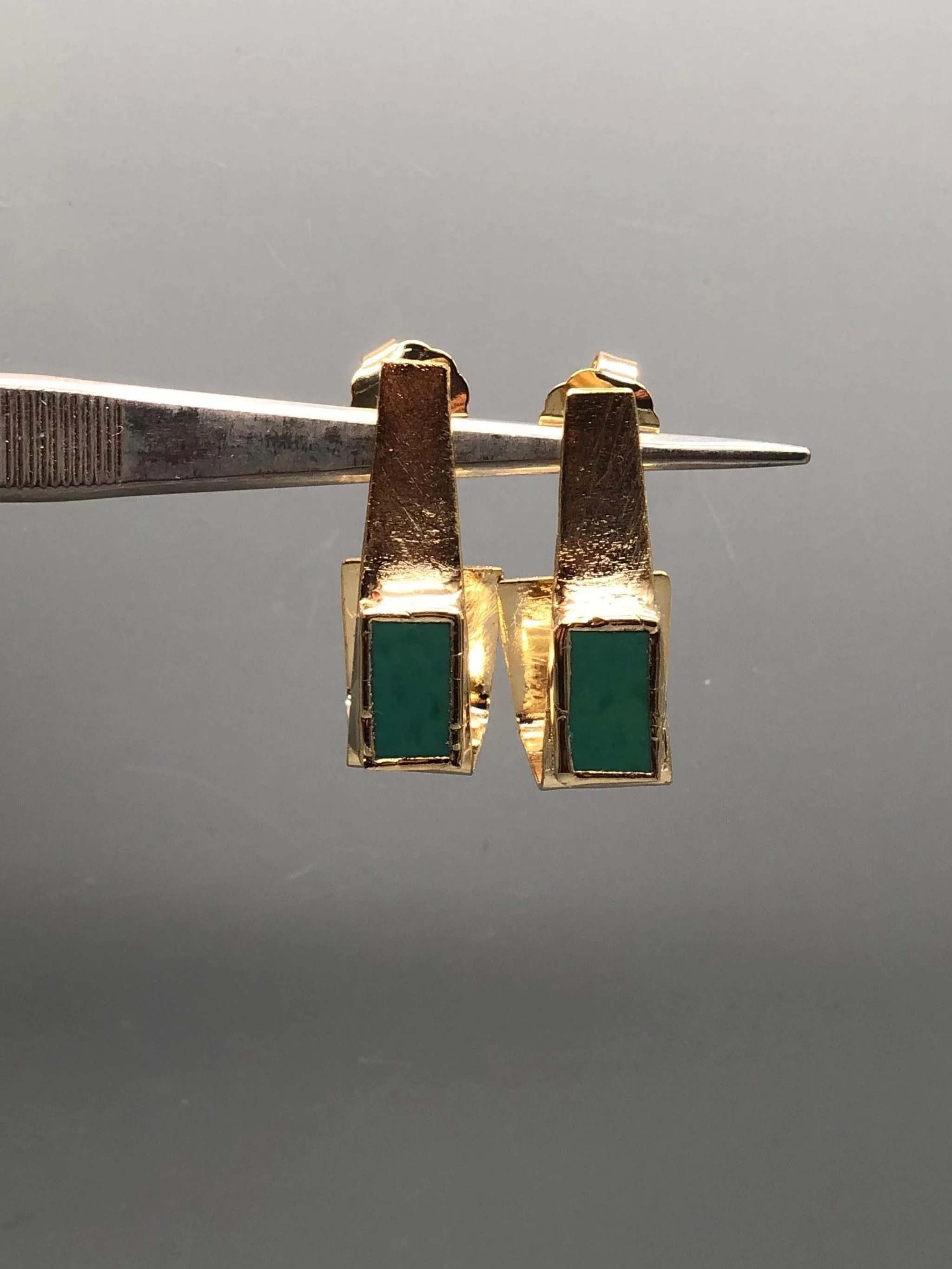 Anni Luce Risvolto earrings in 18k gold-plated brass with mint-green Murano glass, contemporary Italian designer jewellery.