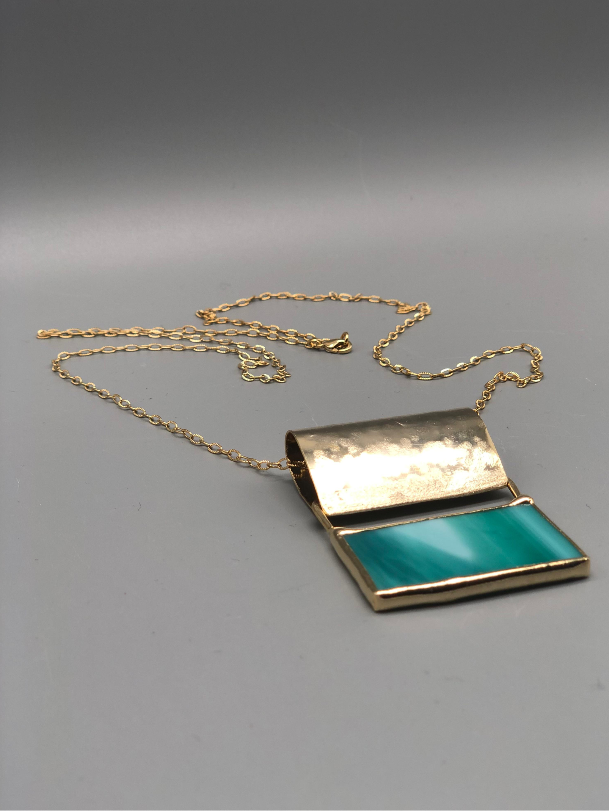 ‘70 Azzurro necklace by Anni Luce for Crepundia Gioielli Bologna, 18k yellow gold plated brass with blue Murano glass, geometric pendant