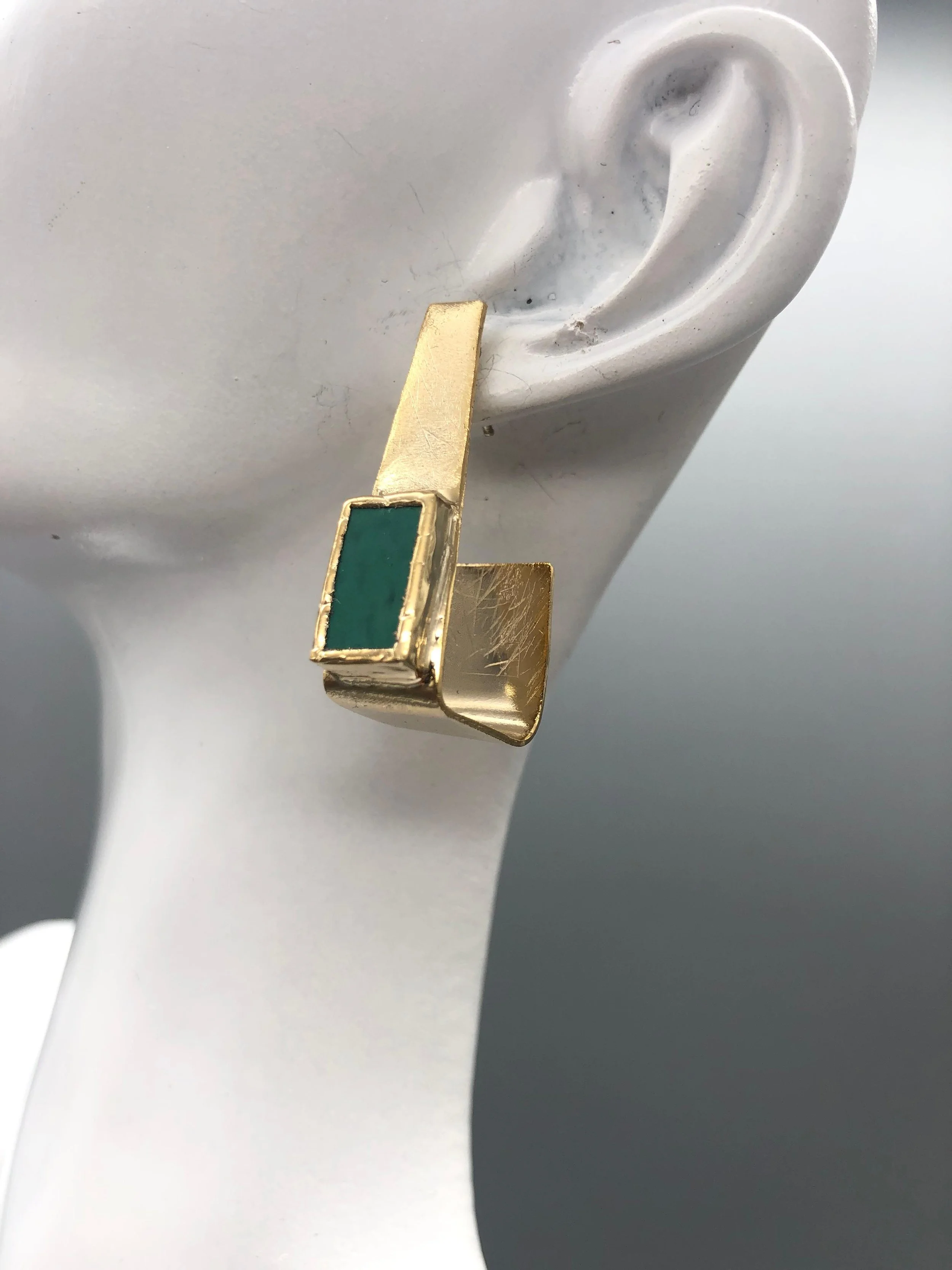 Anni Luce Risvolto earrings in 18k gold-plated brass with mint-green Murano glass, contemporary Italian designer jewellery.