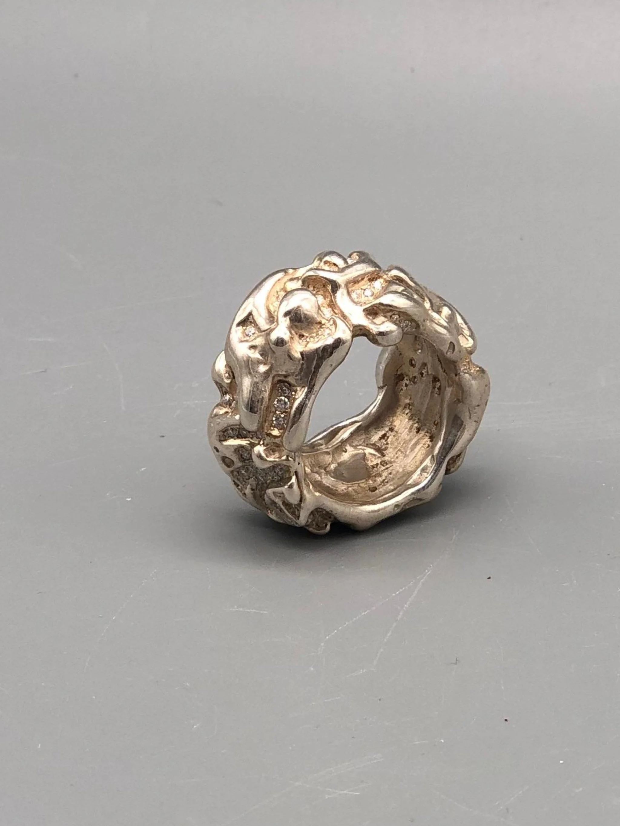 Portas Jewels Skinwalker ring set with 142 moissanites, featuring an intricate organic surface and sculptural silver band.