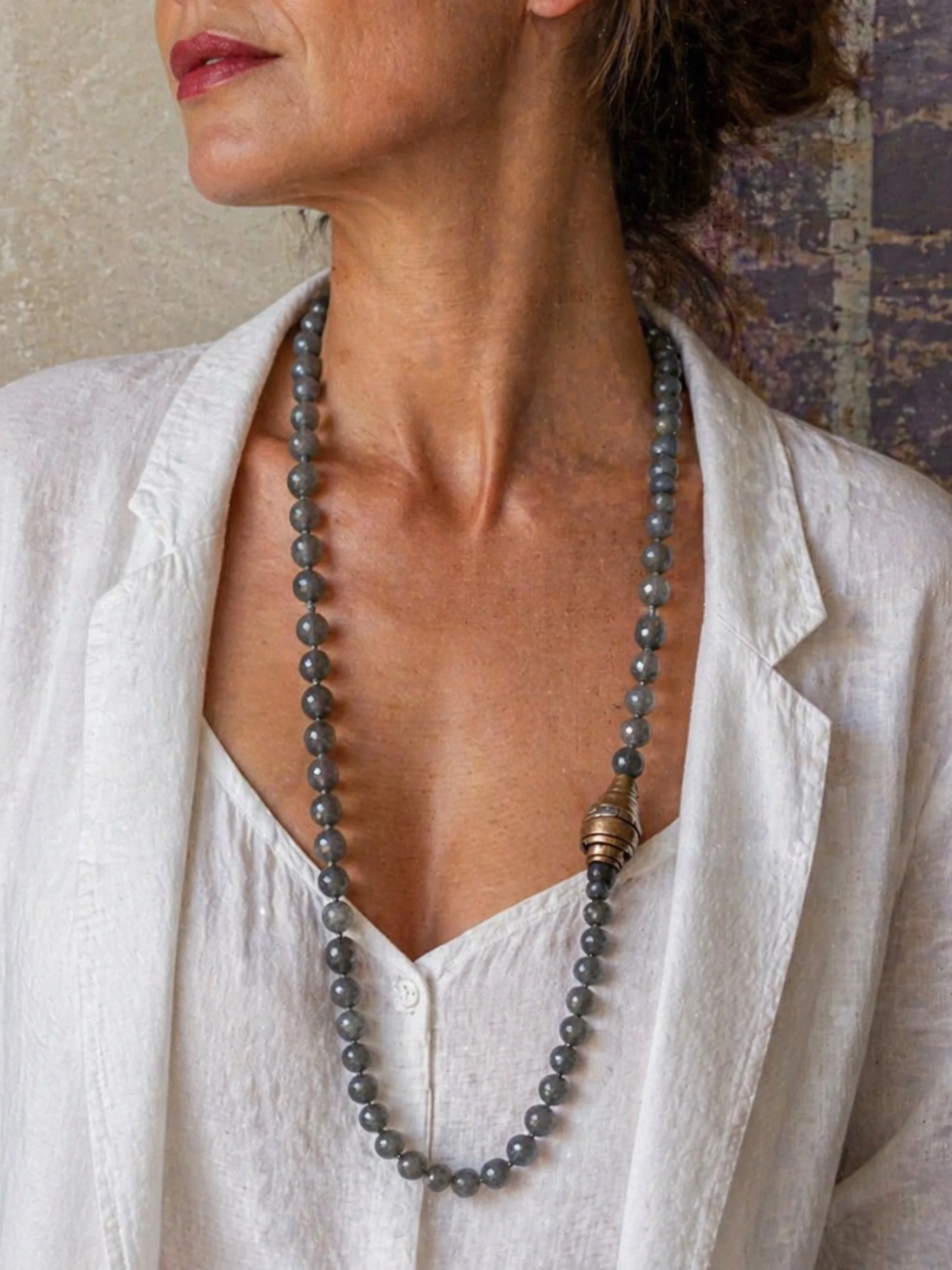 Faceted grey agate necklace with sculptural bronze and silver element by Padma — Crepundia Gioielli Bologna