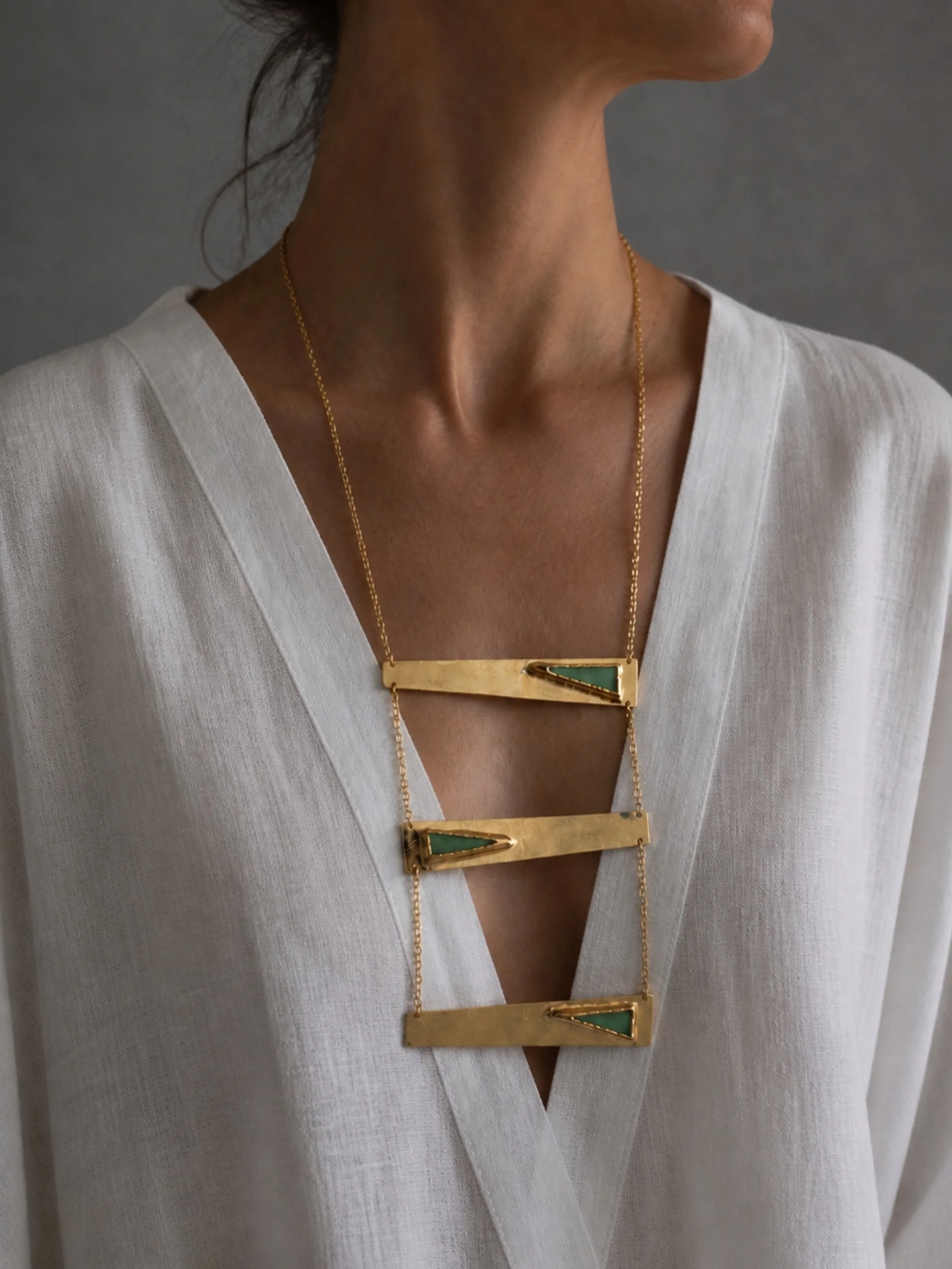 Contemporary rectangular necklace by Anni Luce in gold-plated metal with mint green enamel detail, Crepundia Gioielli Bologna