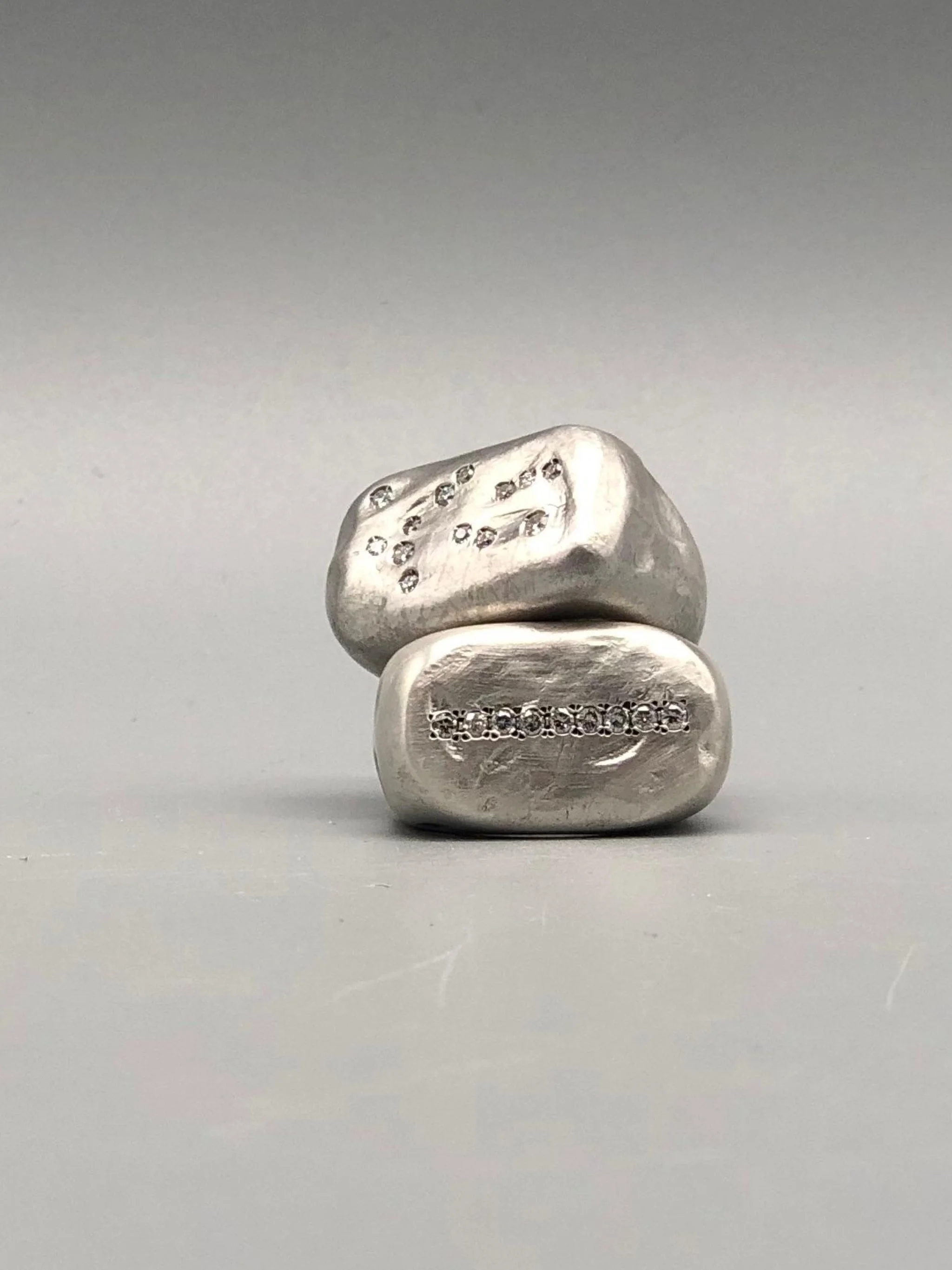 Crepundia Gioielli matte silver Echo ring with diamonds.