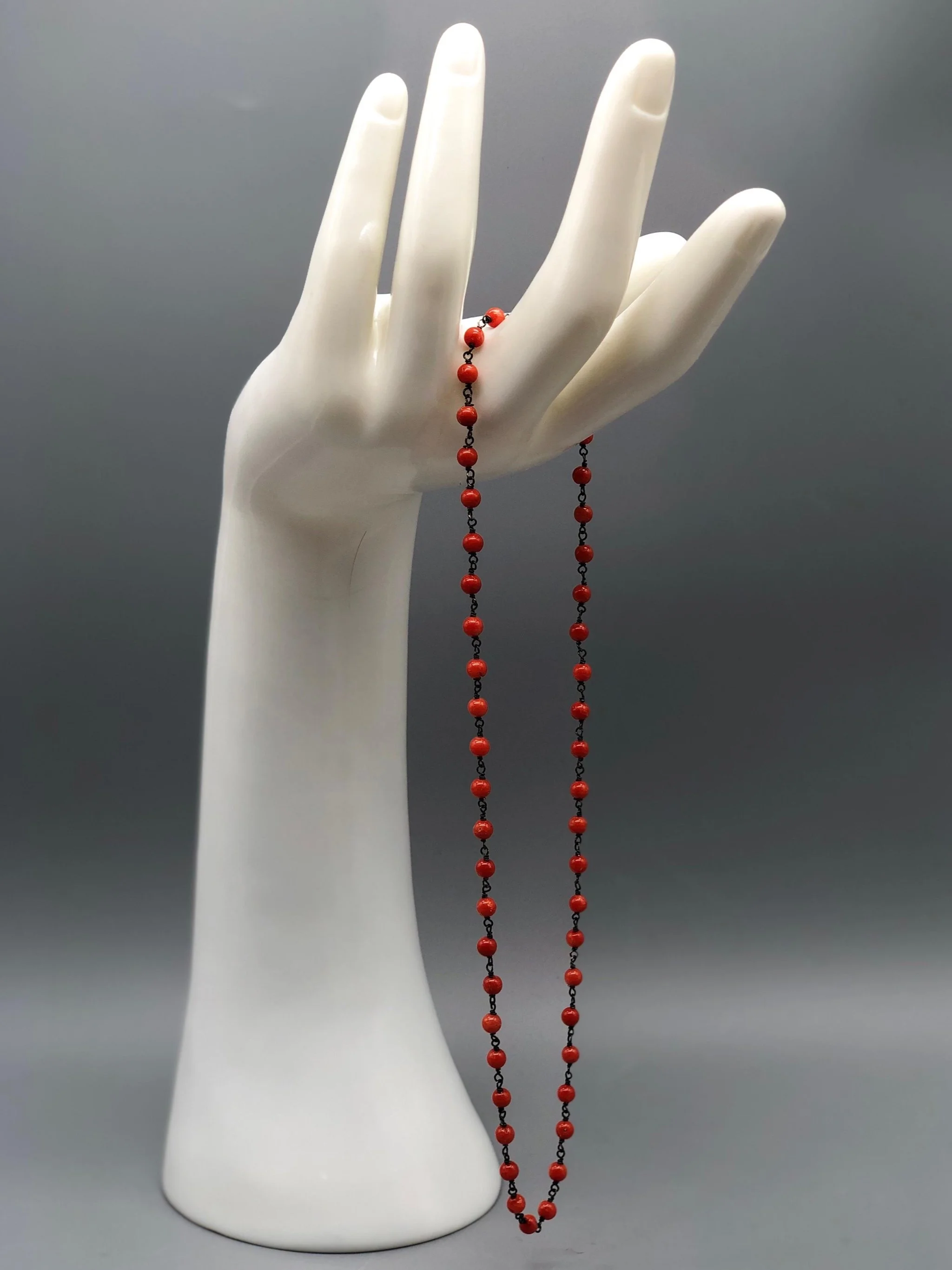 coral rosary necklace in oxidized sterling silver by Crepundia Gioielli.