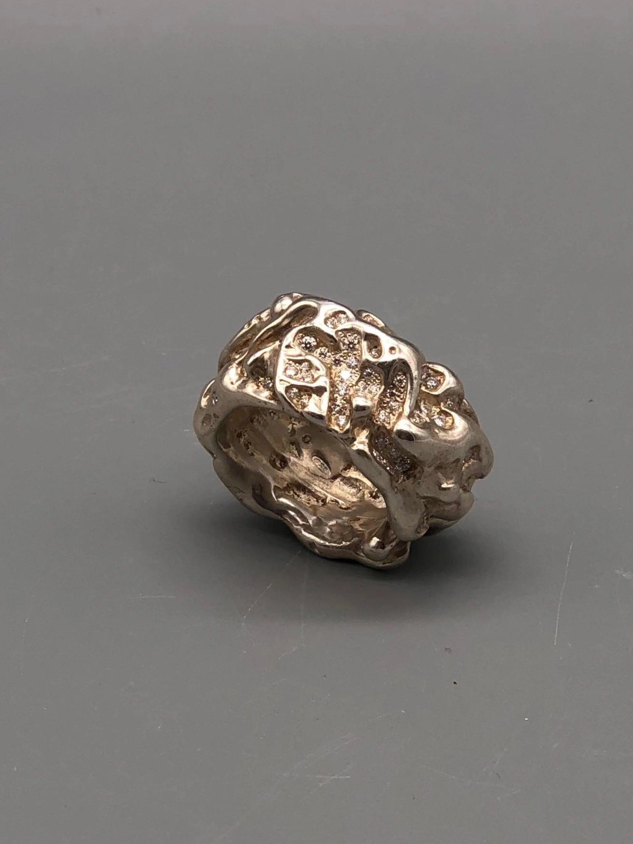 Portas Jewels Skinwalker ring set with 142 moissanites, featuring an intricate organic surface and sculptural silver band.