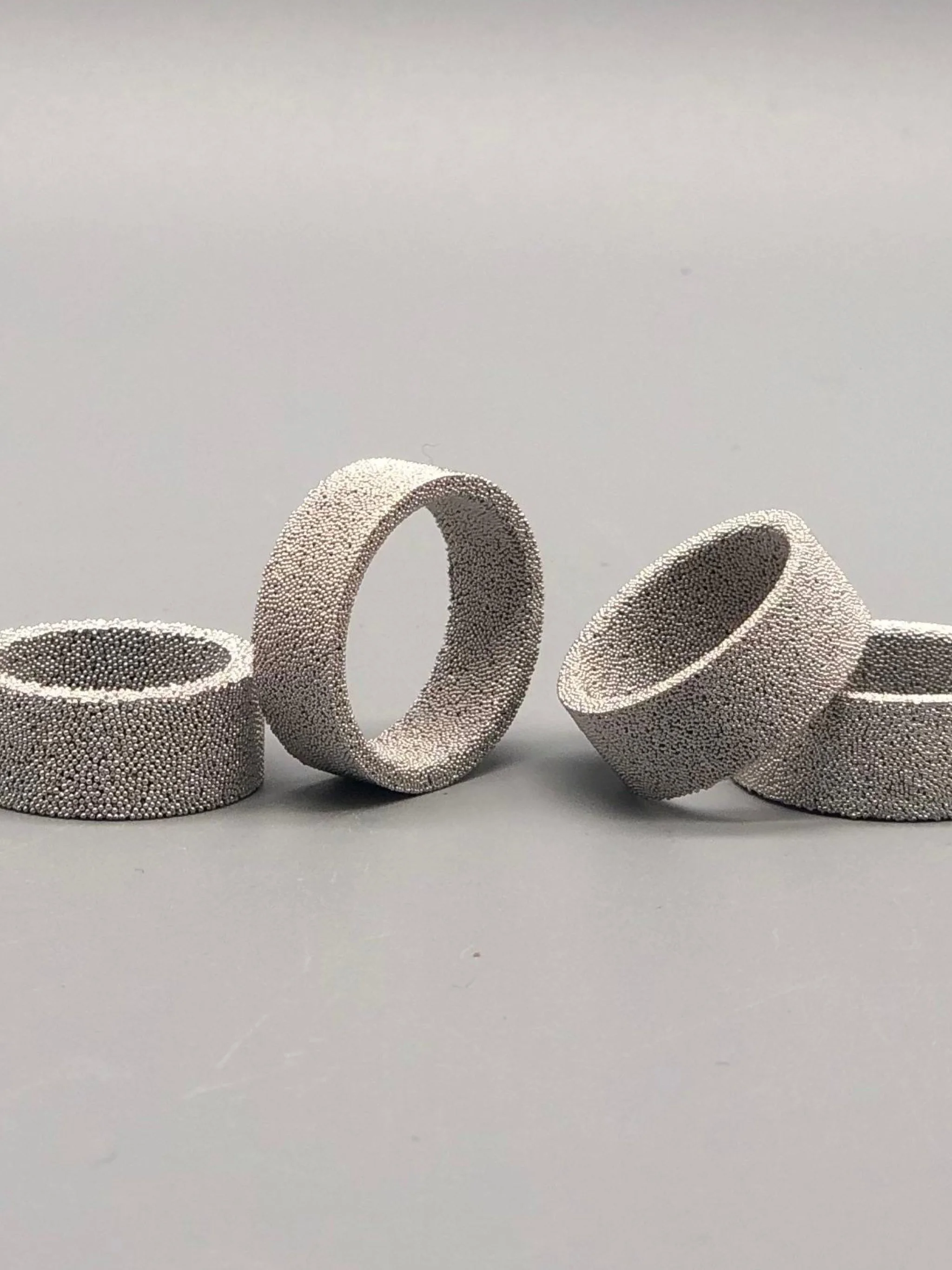 Ring Materia 01 by Francesca Valpiani in granular textured metal, sculptural band design — Crepundia Bologna