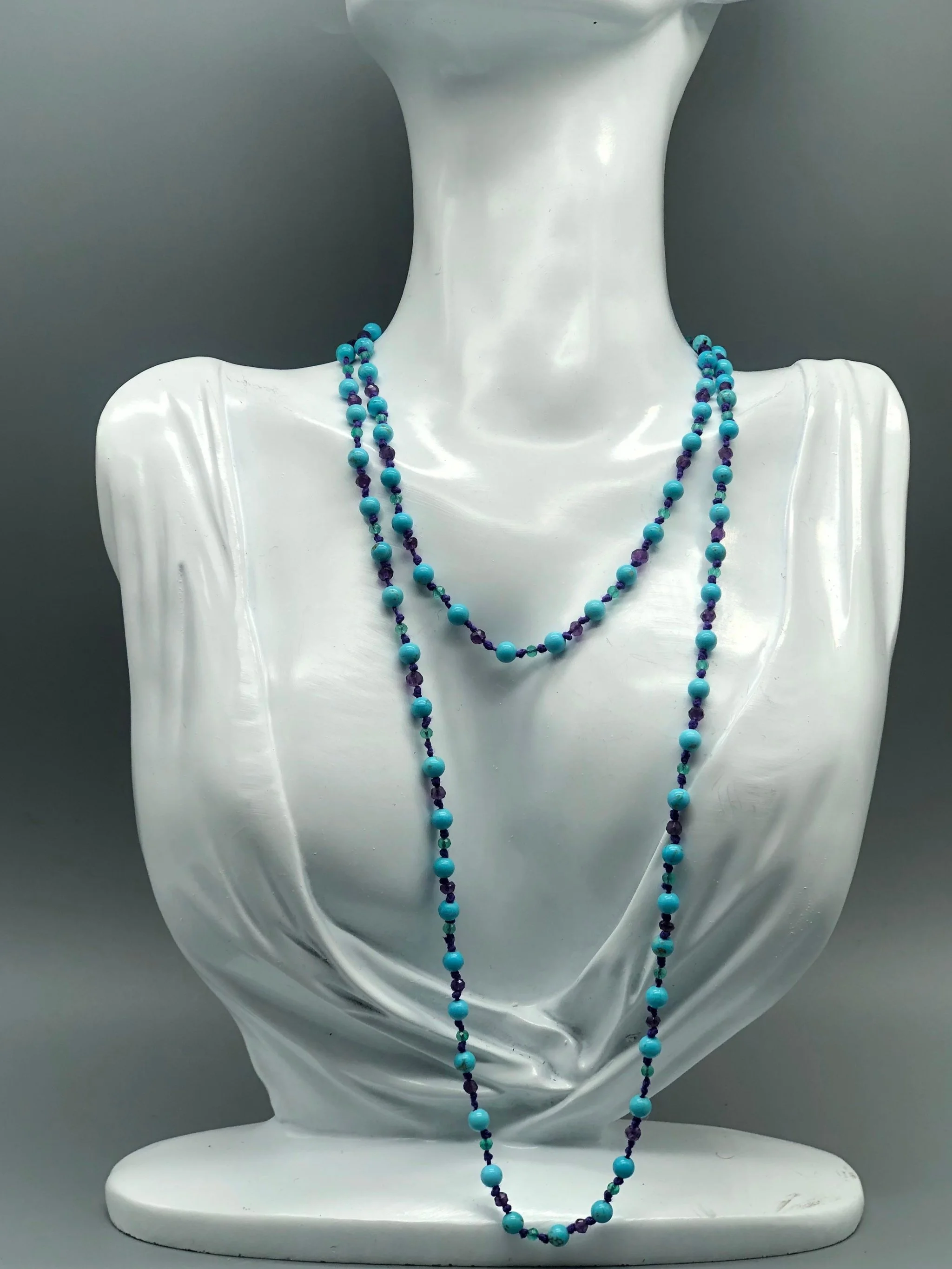 Summer necklace with turquoise, amethyst and aventurine on purple cotton cord. Crepundia Gioielli Bologna.