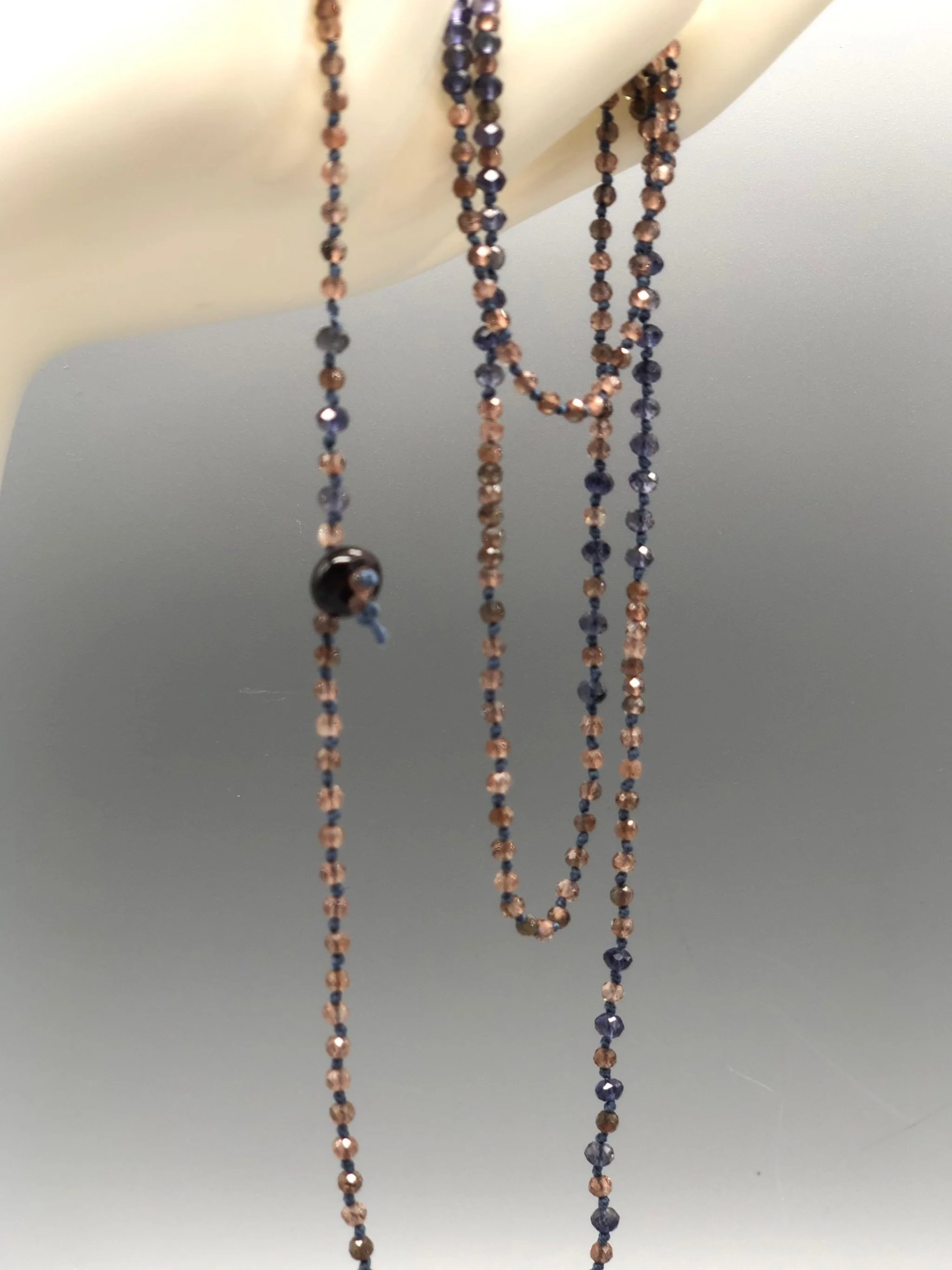 Crepundia Chromatic necklace with blue and rose gemstones