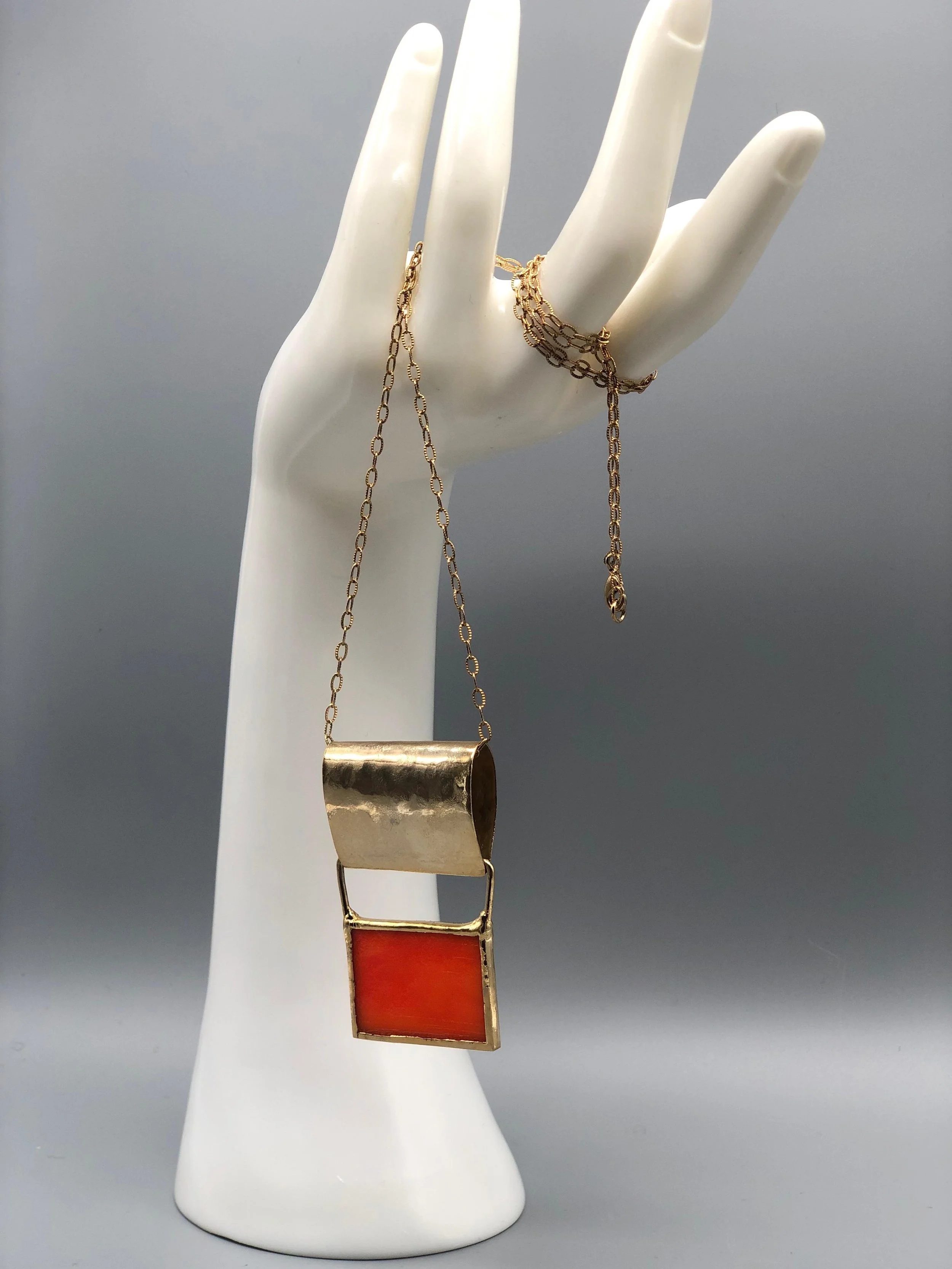 ‘70 Arancio necklace in 18k yellow gold plated brass with orange Murano glass, geometric pendant design — Crepundia Gioielli Bologna