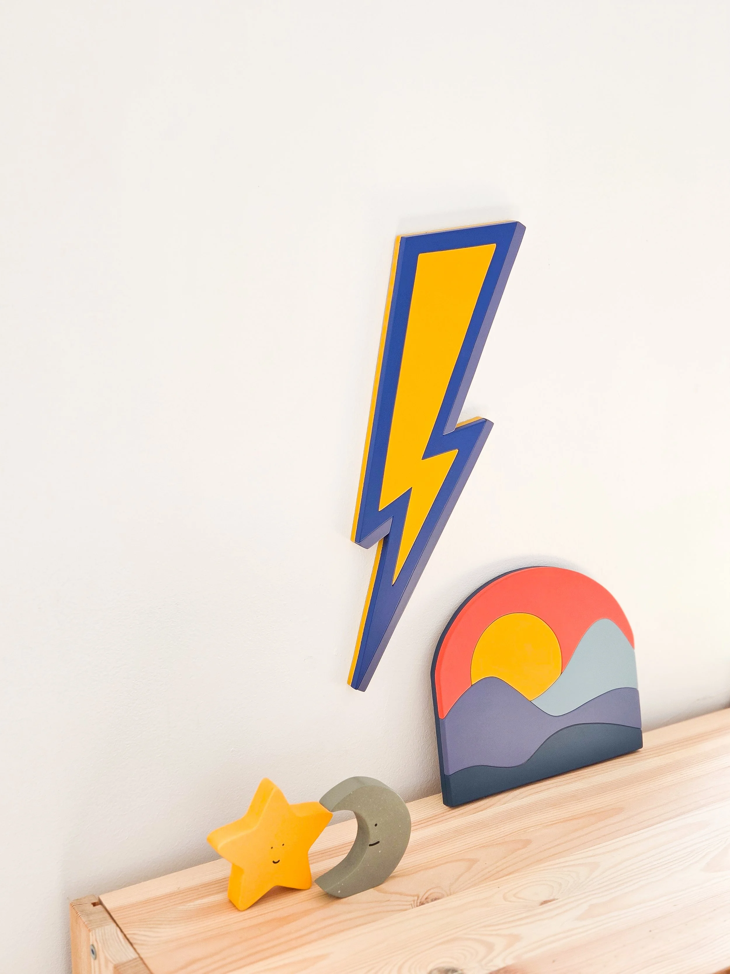 Bright and colourful lightning bolt wooden wall decor