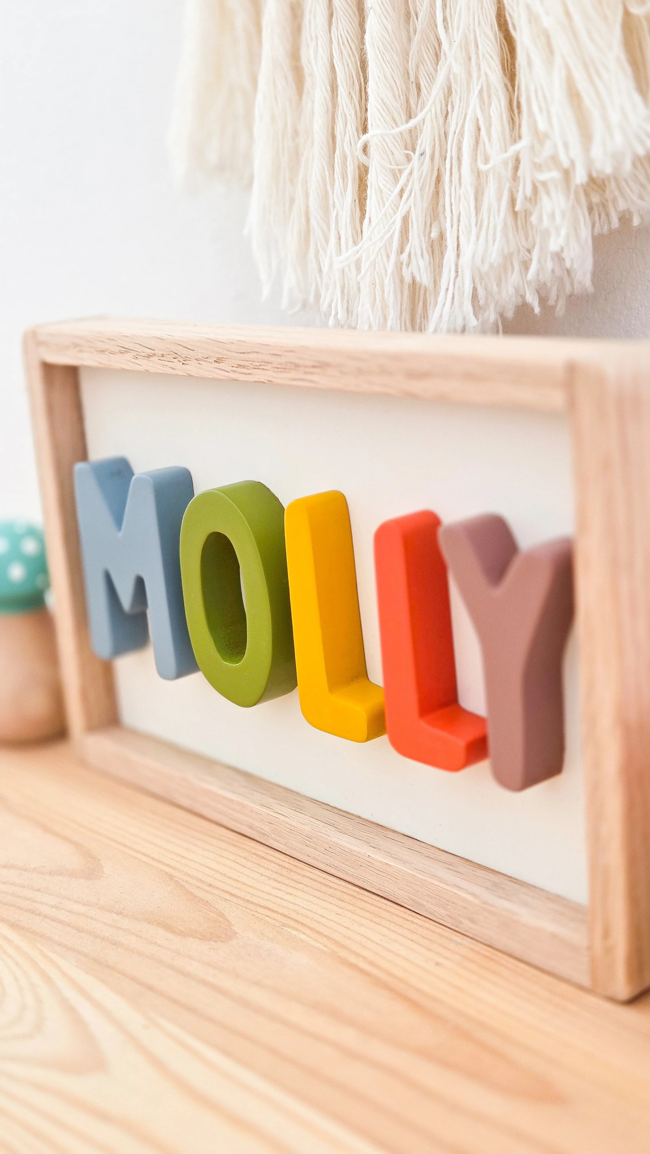 Bright and colourful custom wooden name sign