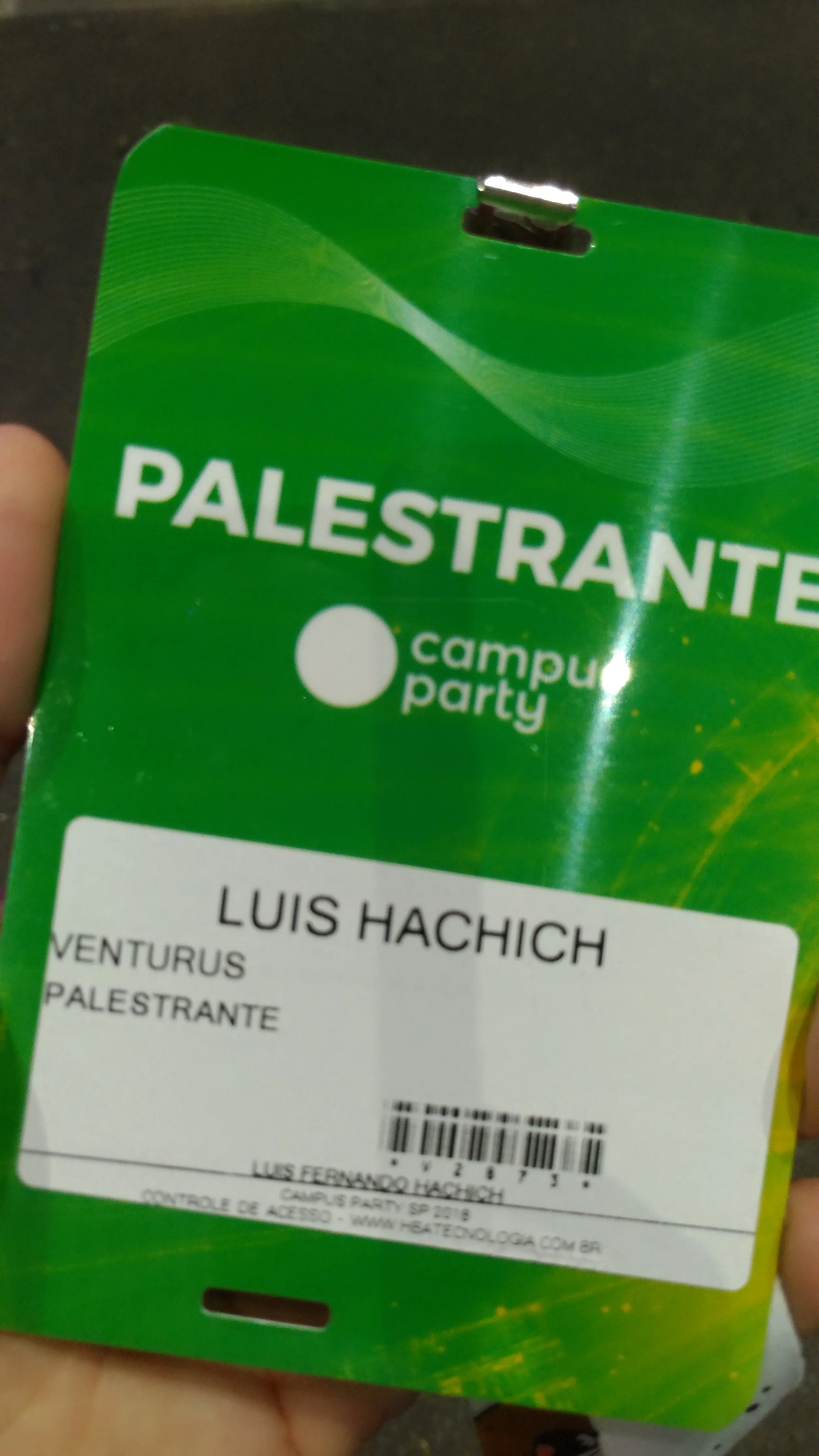 Green event badge or pass for 'Campus Party' with name 'Luis Hachich' and additional event details.