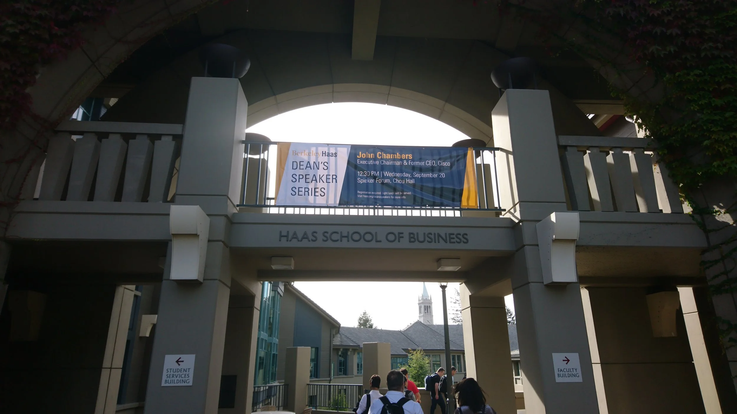 Entrance to Haas School of Business at UC Berkeley, with a banner advertising a speaker event by John Chambers.