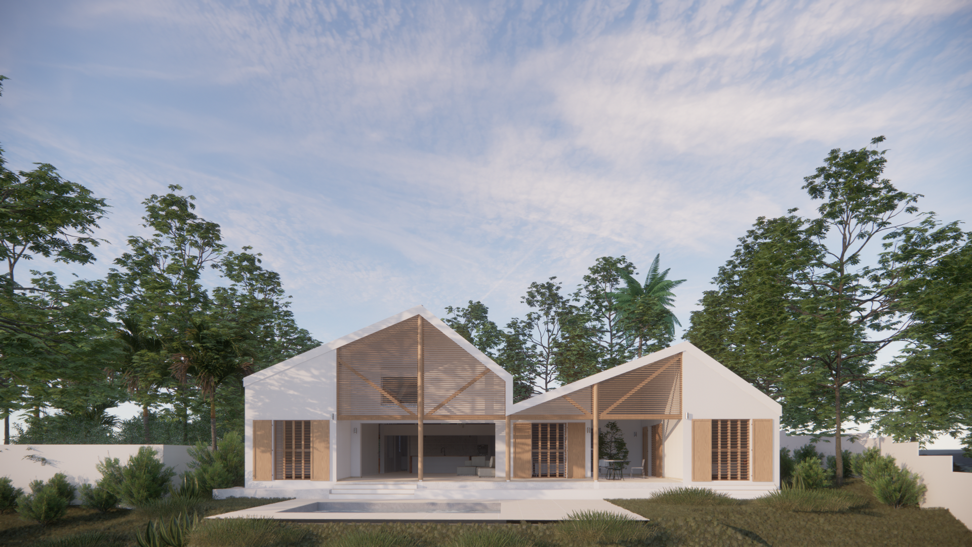 Maison moderne avec toiture en A, murs blancs, et structures en bois, entourée d'arbres et de végétation, sous un ciel partiellement nuageux.