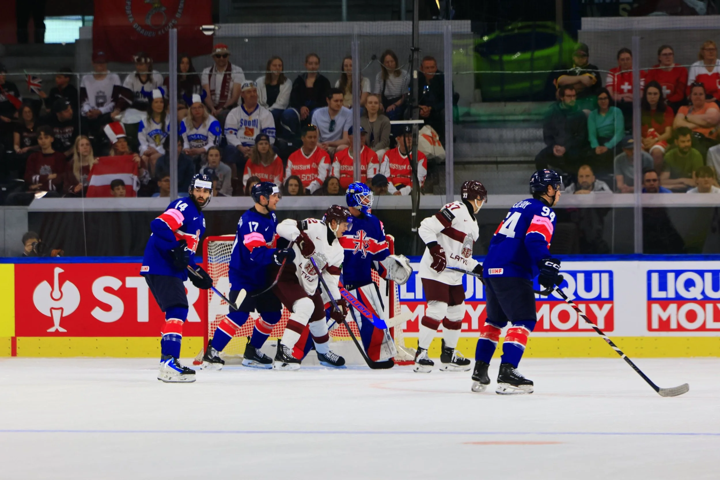 #14 Liam Kirk, #17 Mark Richardson and #94 Cade Neilson protecting a shot on goal with goalie #20 Mat Robson.JPG