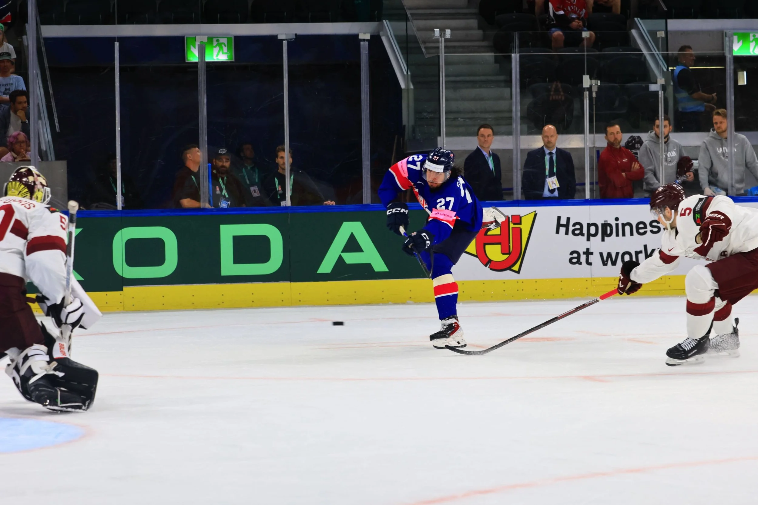 #27 Cole Shudra takes a shot at Latvia's goalie.JPG