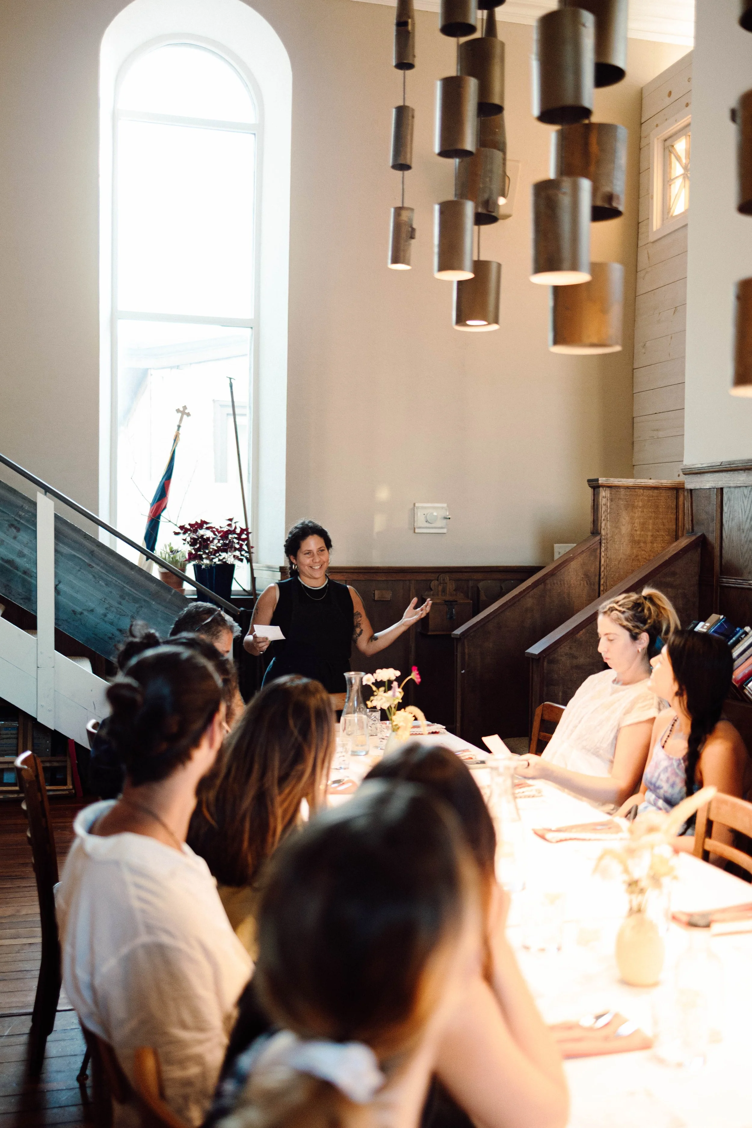 Person gives a talk in a sun drenched room at 3580 in East Falls Philadelphia