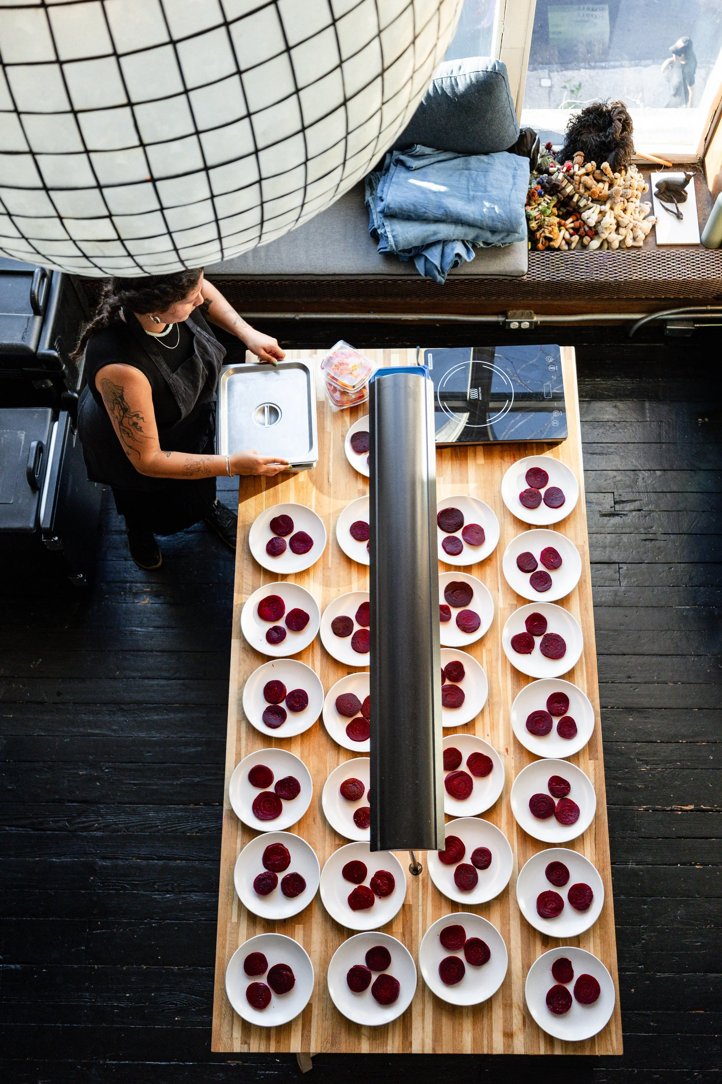 A chef prepares catering for dinner party at 3580 in East Falls