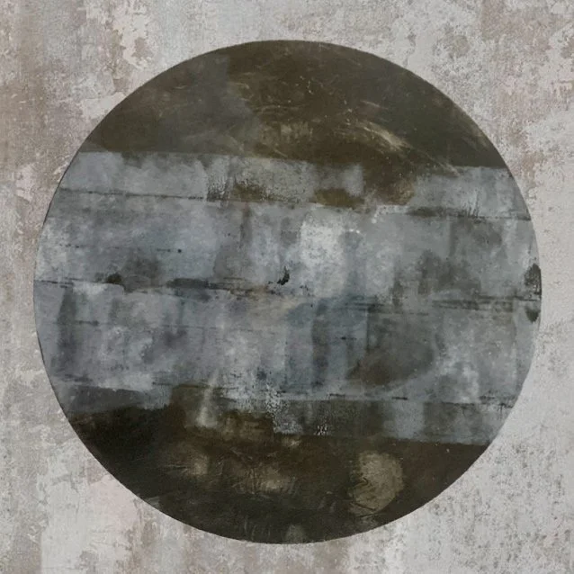 A round globe or moon distressed, industrial-style background.
