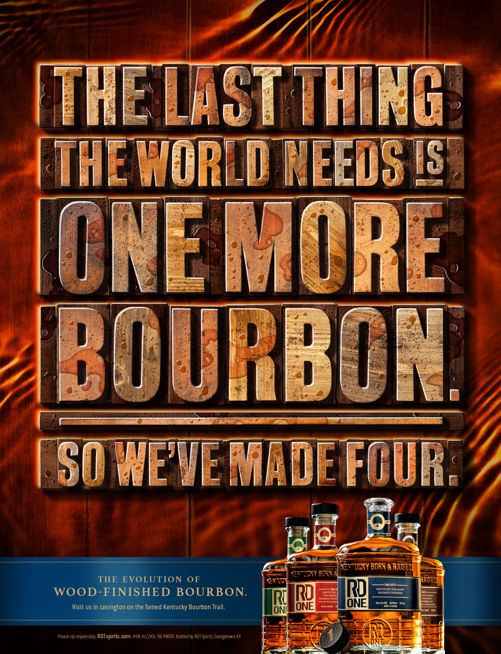 Full page print ad featuring a wooden barrel background, wood block letters, and a headline that reads, "The last thing the world needs is one more bourbon. So we've made four."