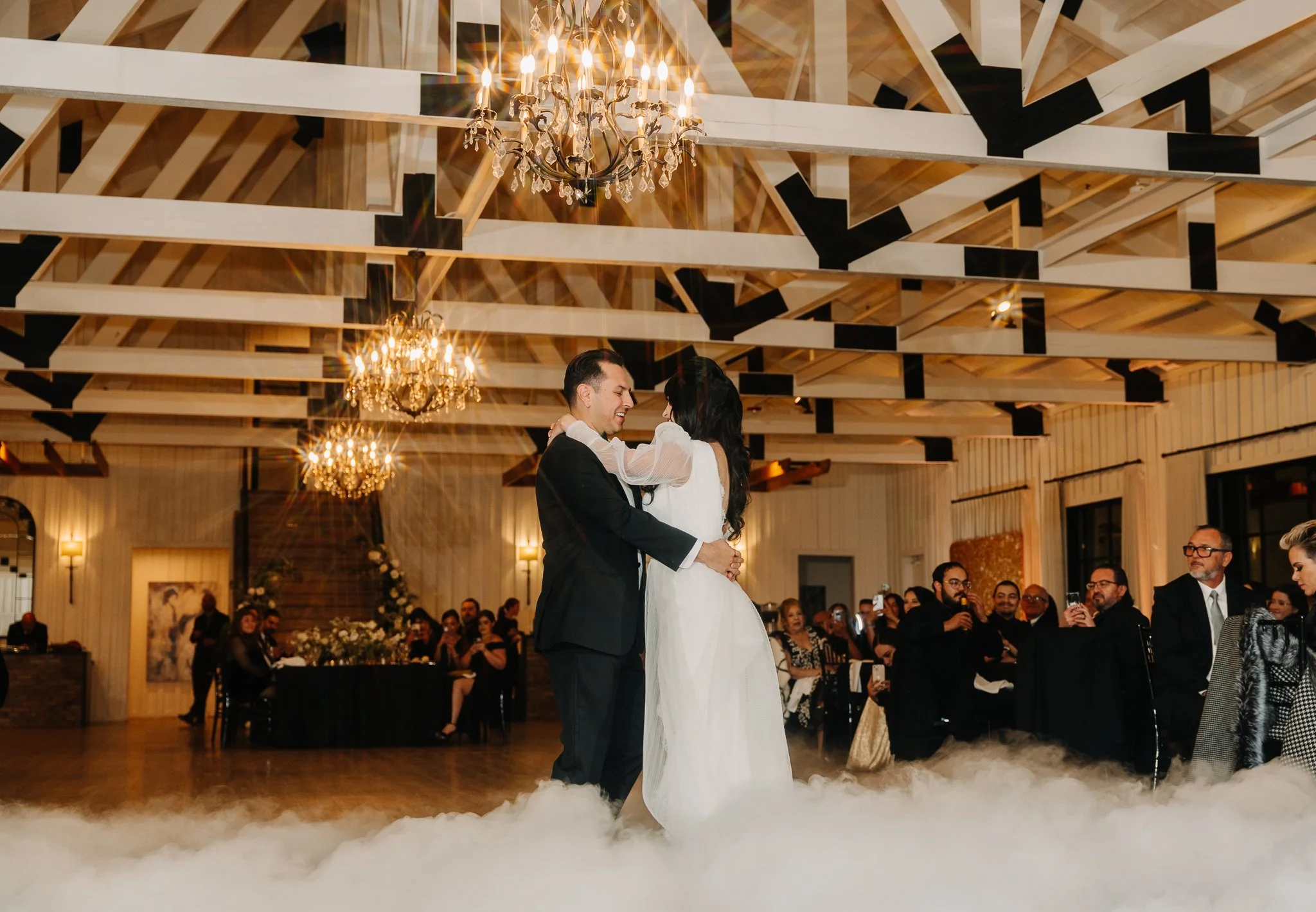 Bride and Groom Dancing with a smoke filled dance floor, first dance, at the milestone in Georgetown texas shot by Photos by Mkay Wedding Photography