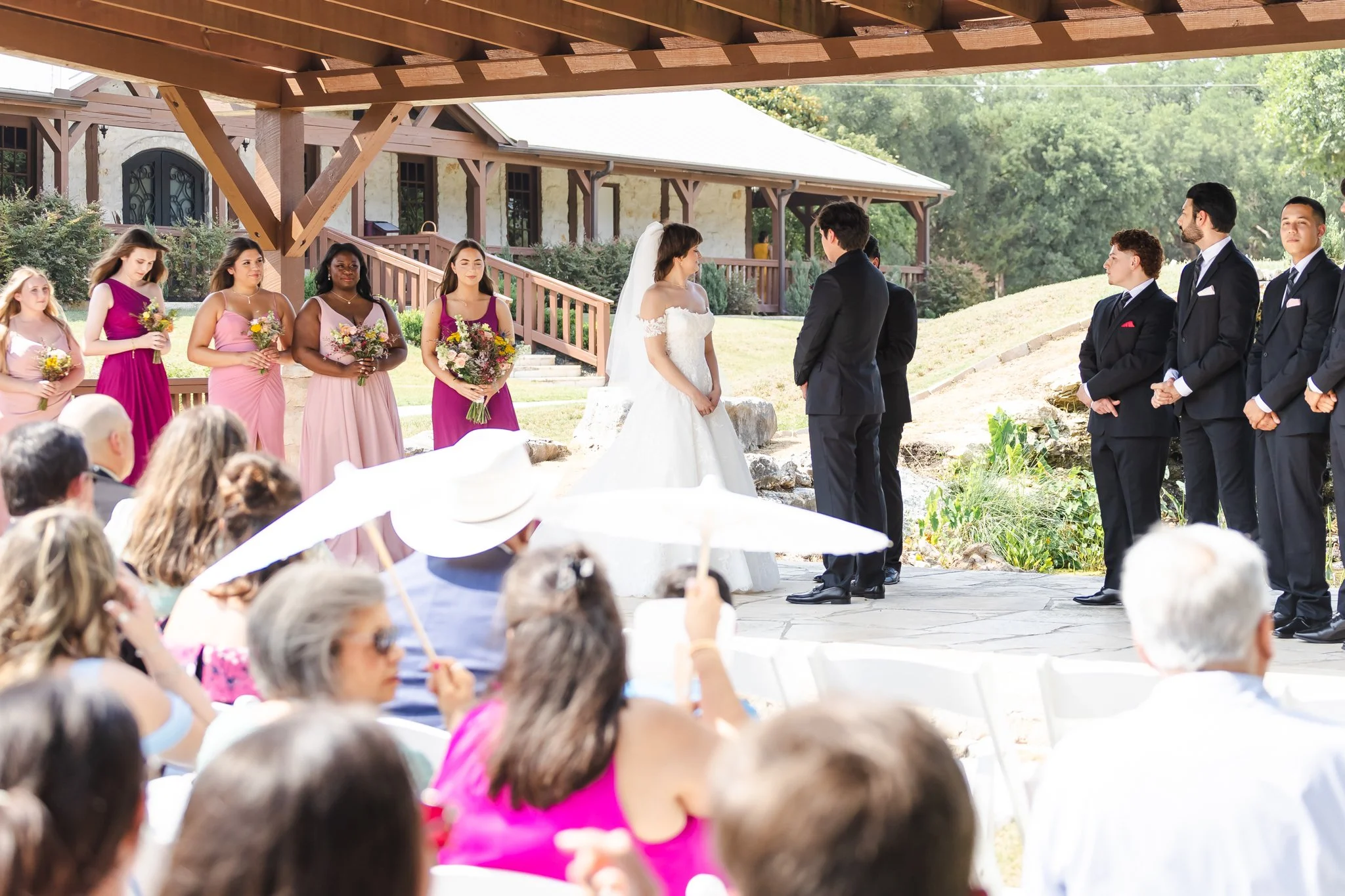 Bride and Groom at the alter during the ceremony shot at Texas Old Town in Buda TX for Photos by Mkay Wedding Photography