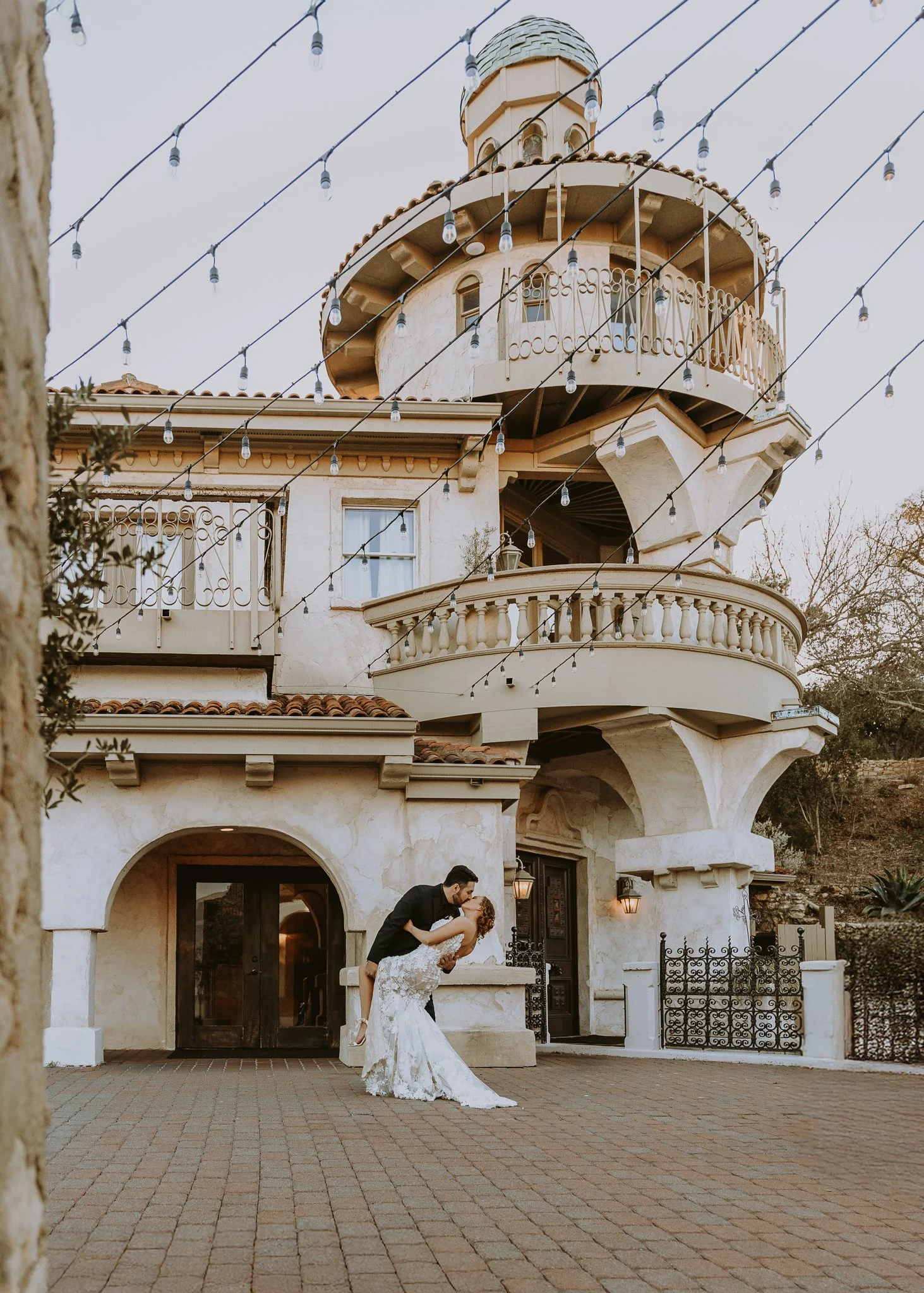 beautiful tuscan wedding venue in Austin texas bride and groom shot in front of villa