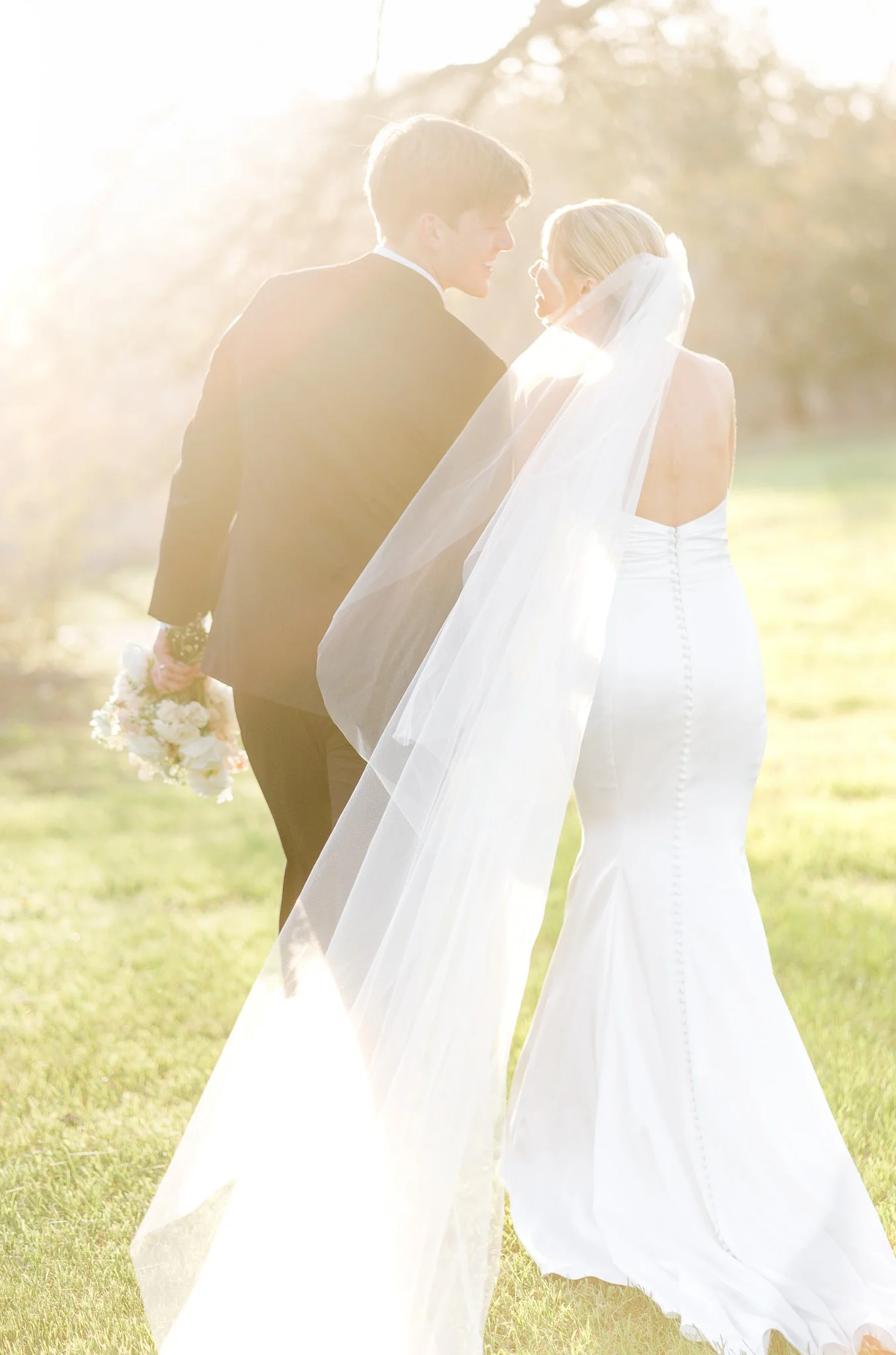 Two lovers walking during golden hour bride and groom photos shot by photos by mkay wedding photography