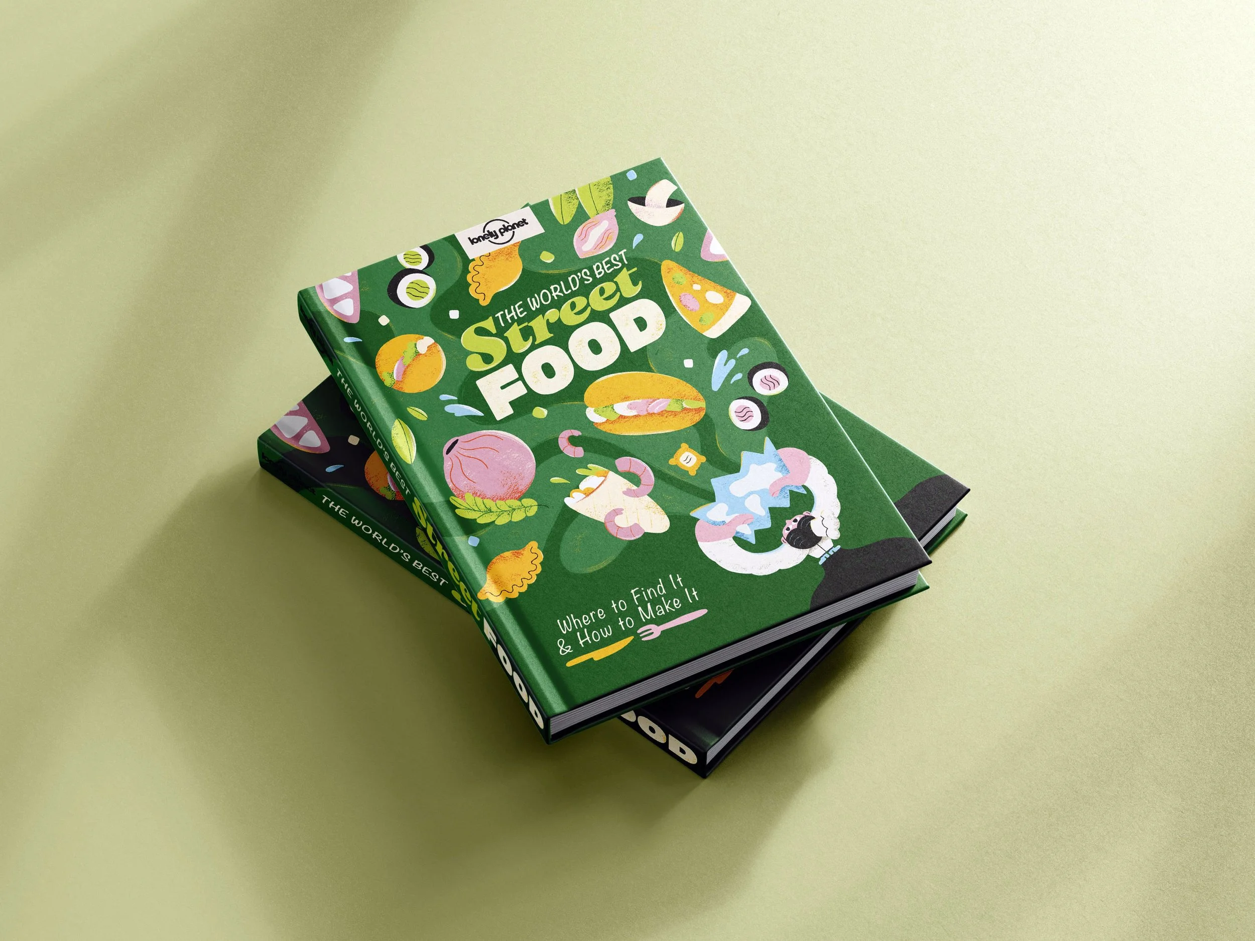 Two recipe books with illustrated covers on the floor